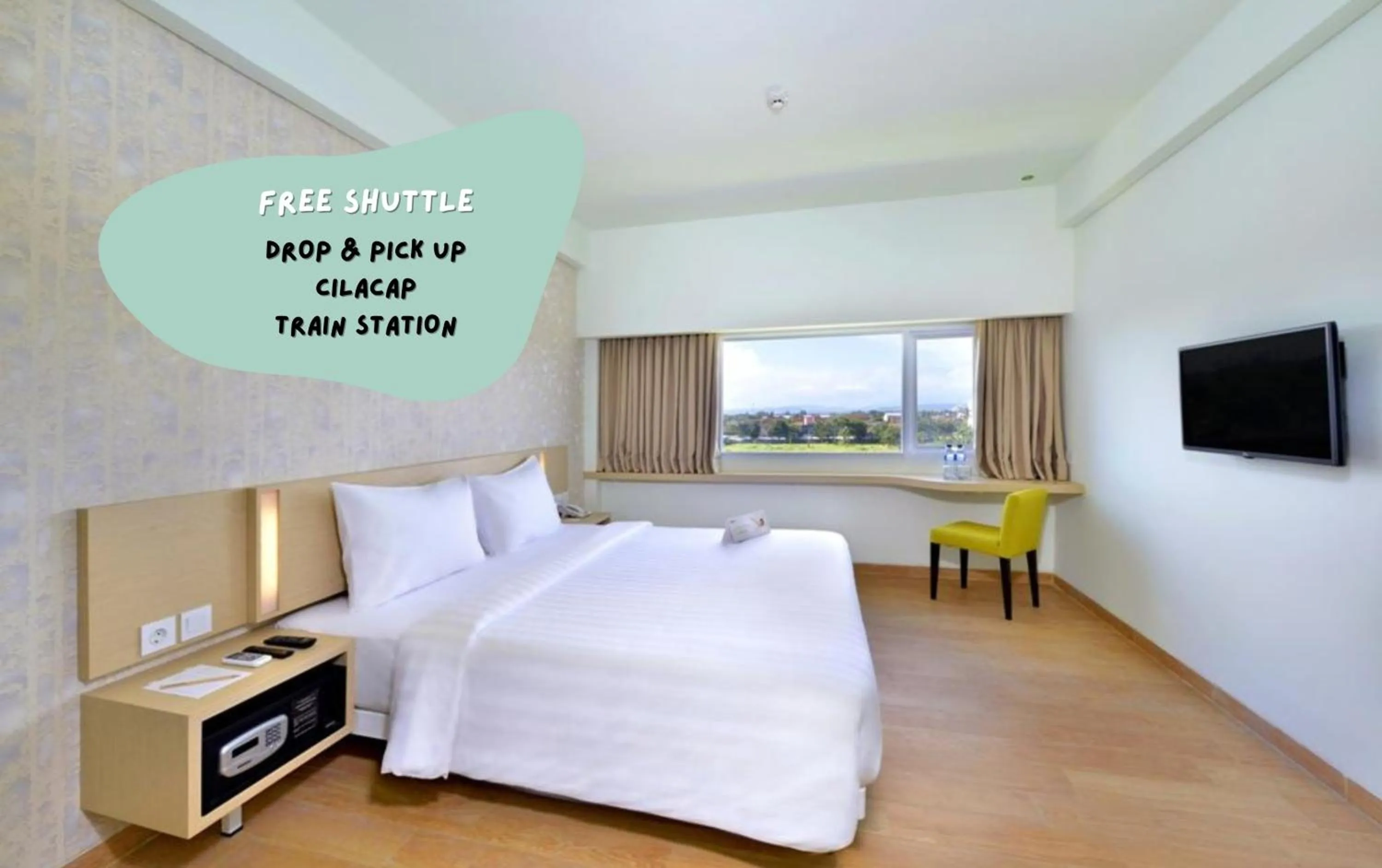 Photo of the whole room, Bed in Whiz Prime Hotel Sudirman Cilacap