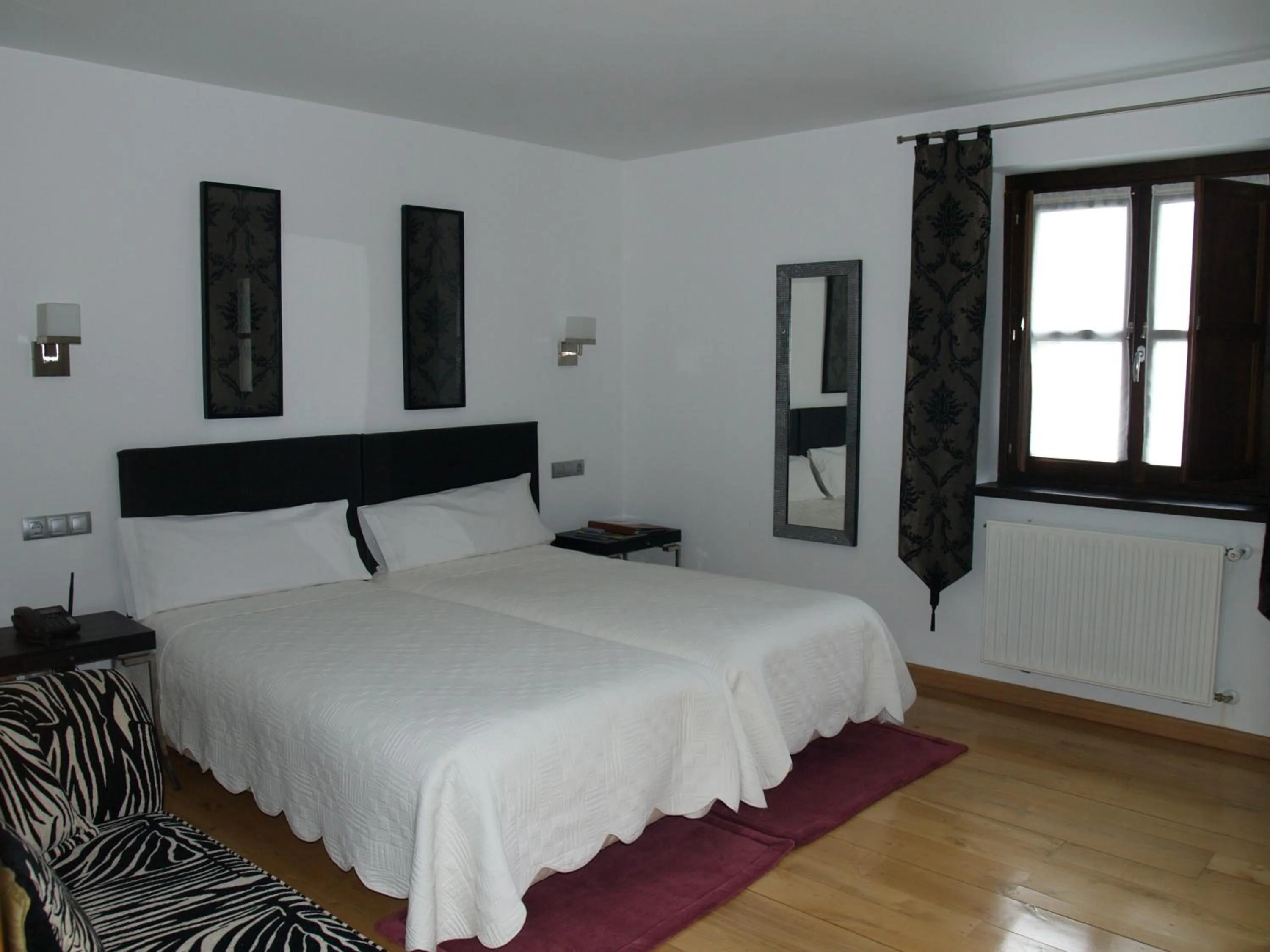 Bed in Hotel y apartamentos rurales L'Anceo