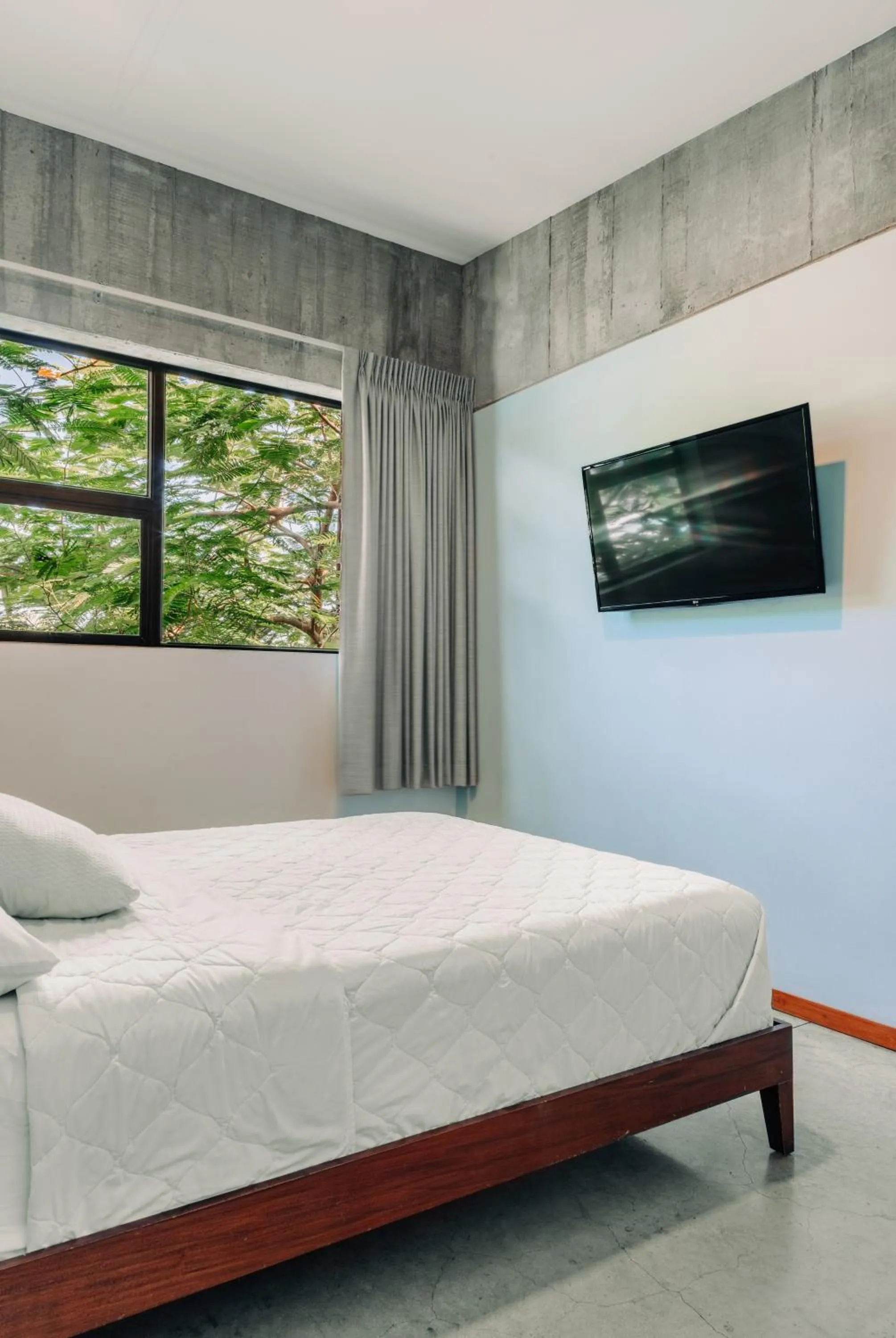 Bed in Puro Surf Hotel & Performance Academy