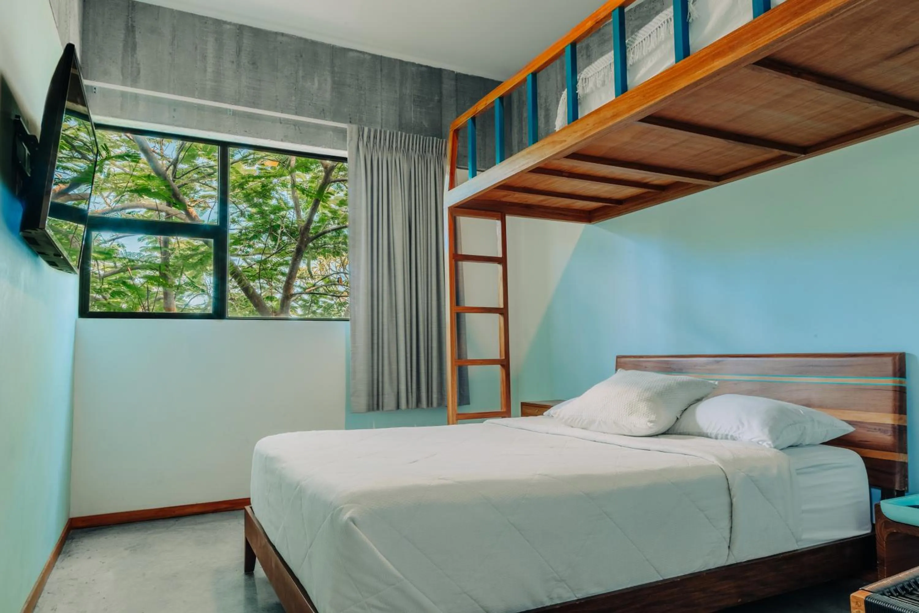 Bed in Puro Surf Hotel & Performance Academy