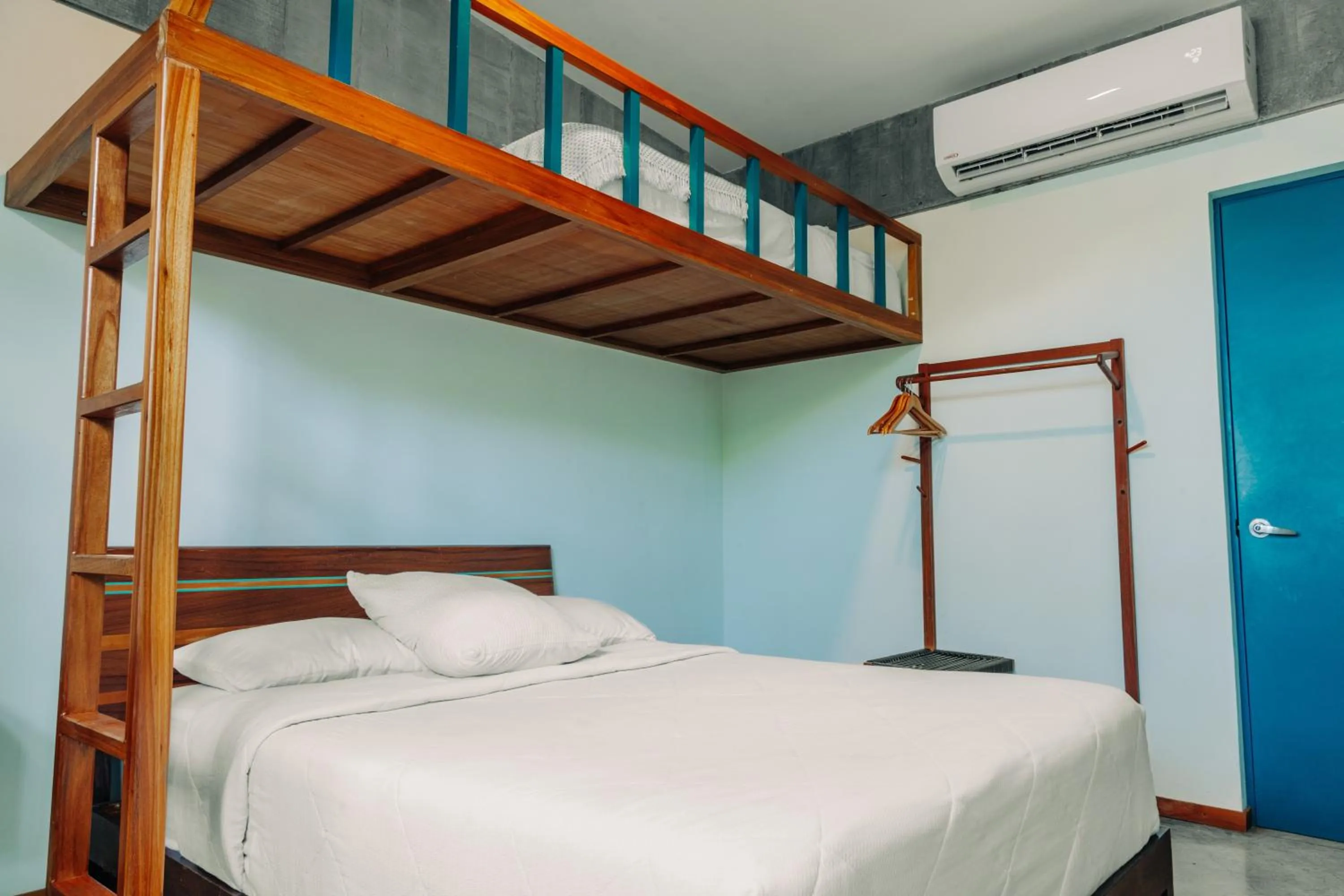 Bed in Puro Surf Hotel & Performance Academy