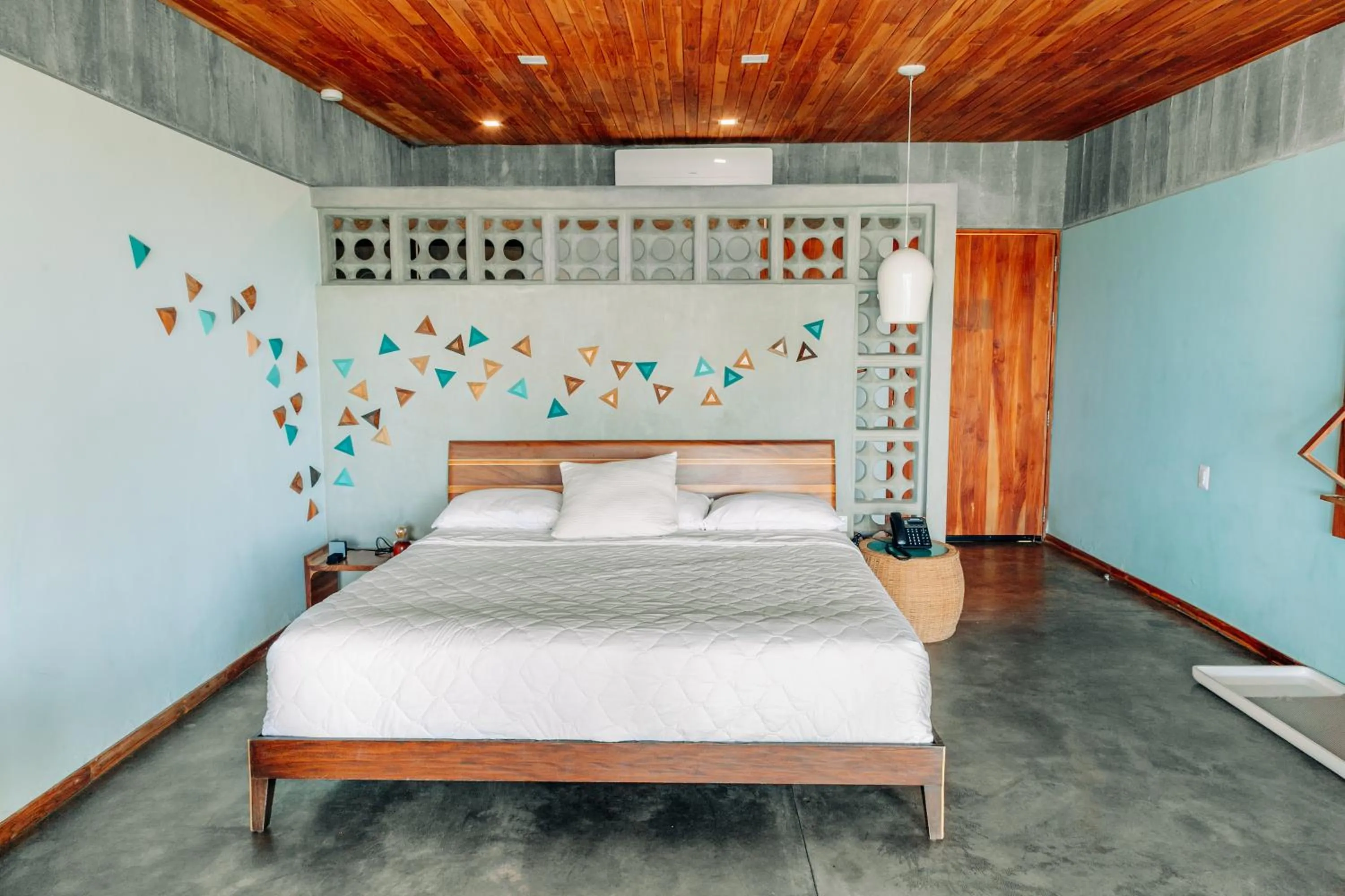Bed in Puro Surf Hotel & Performance Academy