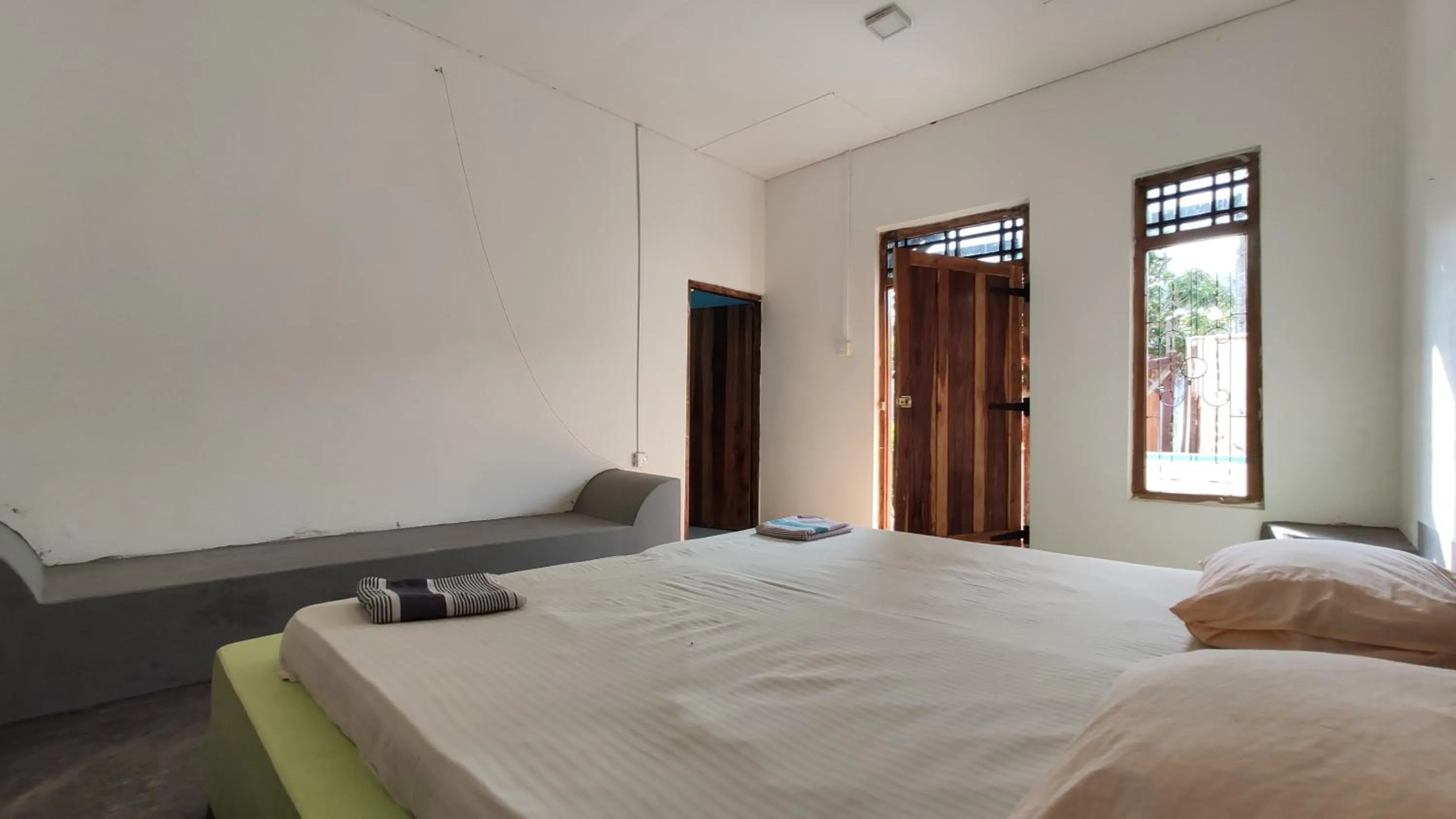 Bed in Surf Beach Hotel