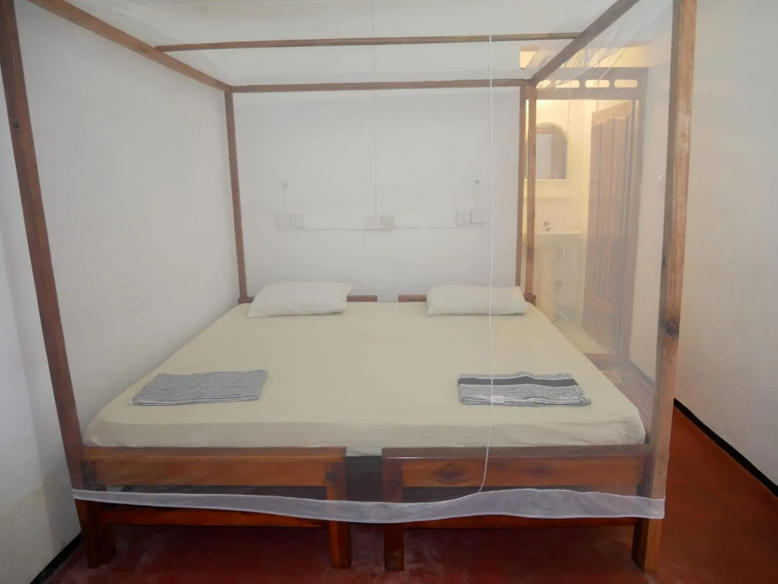 Bed in Surf Beach Hotel