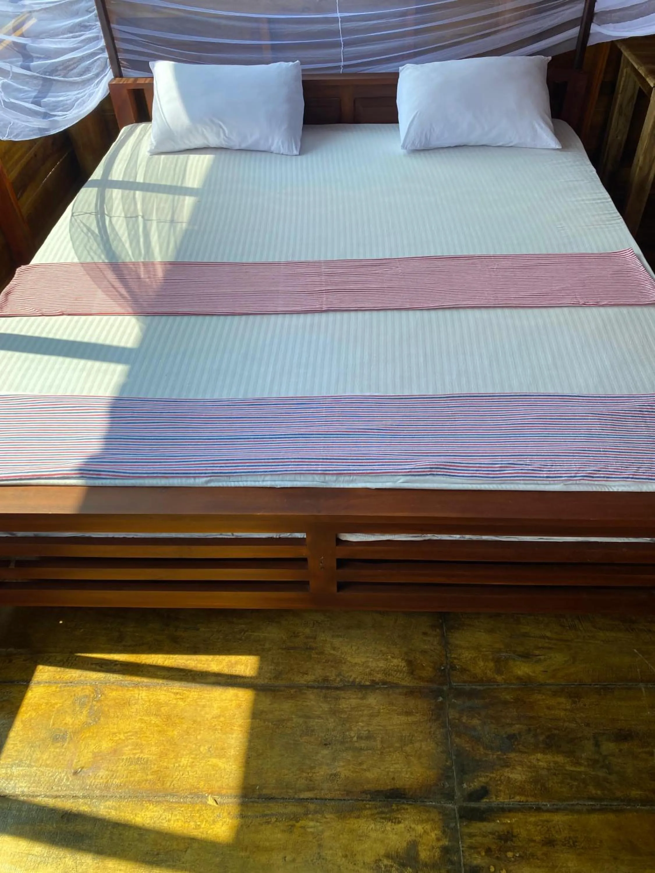 Bed in Surf Beach Hotel