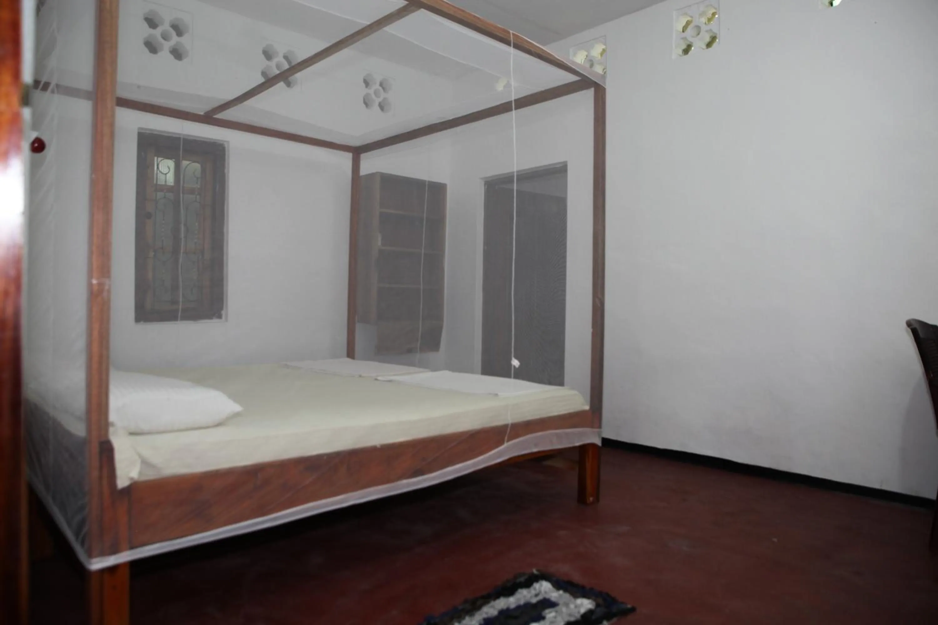 Bed in Surf Beach Hotel