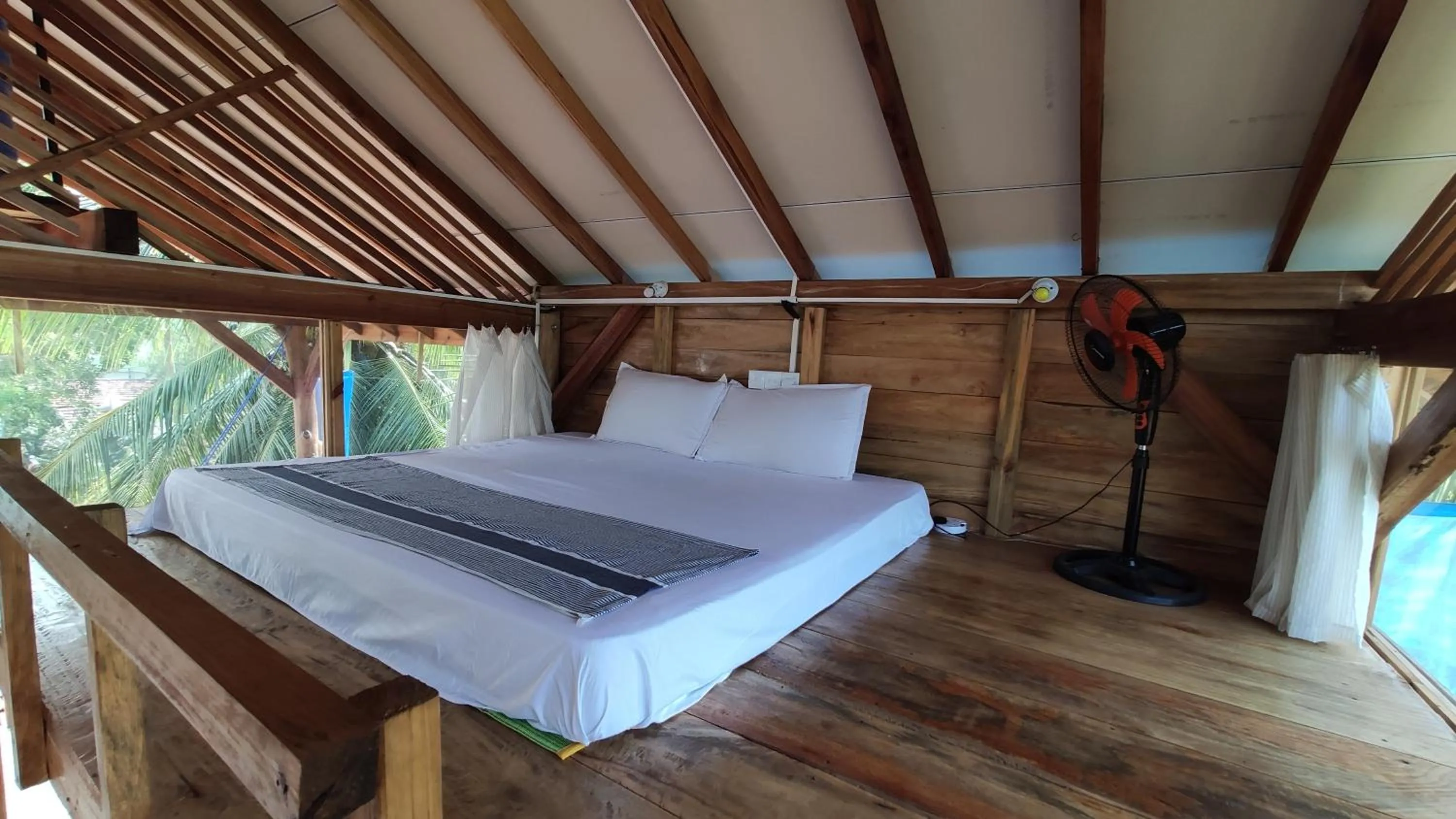 Bed in Surf Beach Hotel