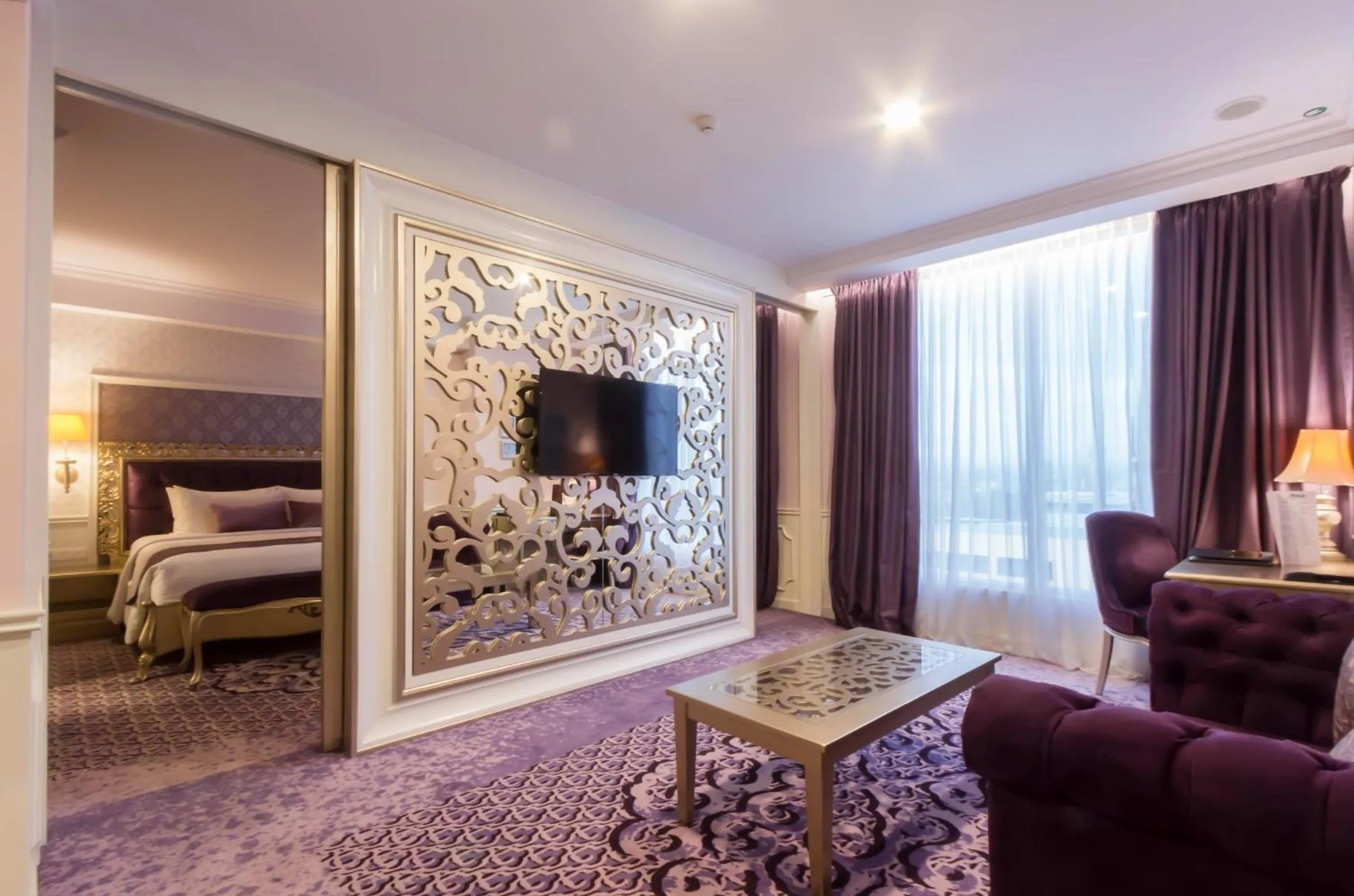 Living room, Bed in Grand Keisha Yogyakarta