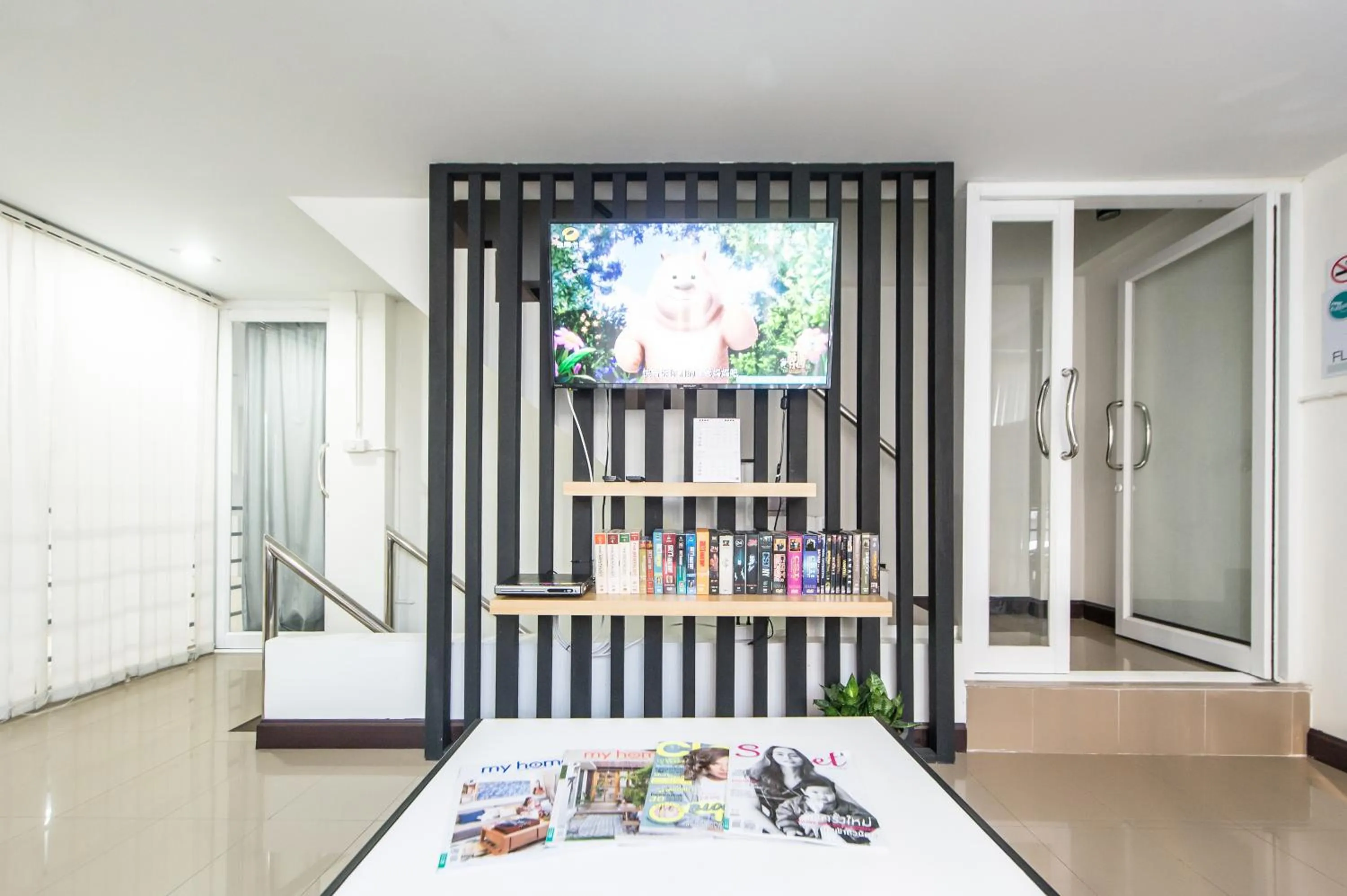 Communal lounge/ TV room in Full stop. Hostel Chiang Mai