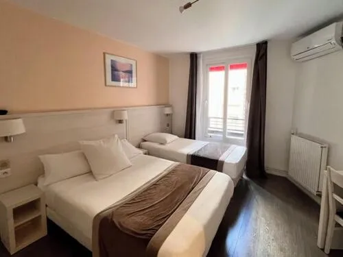 Bed in Luxor Bastille Hotel