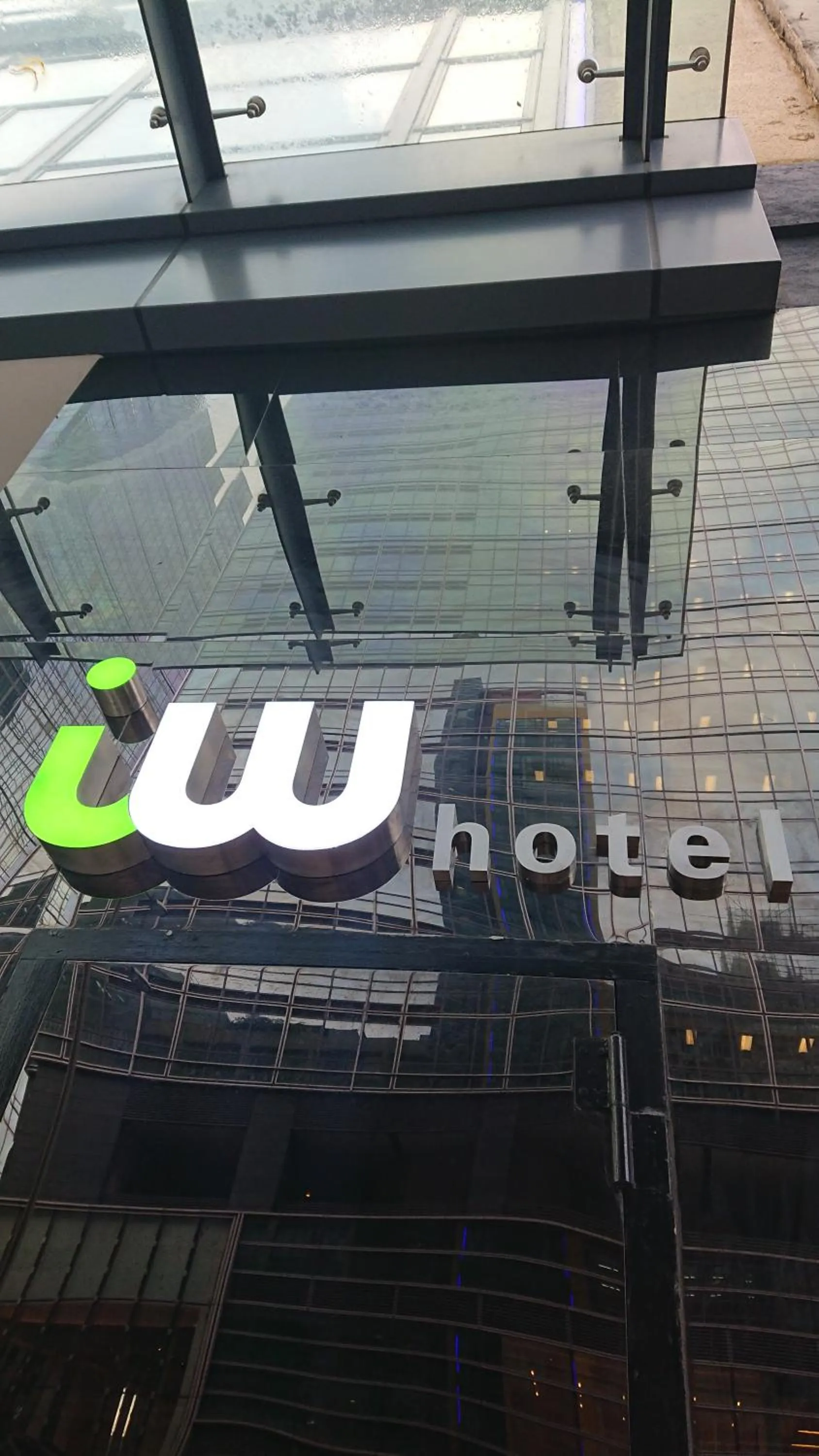 Property logo or sign in IW Hotel