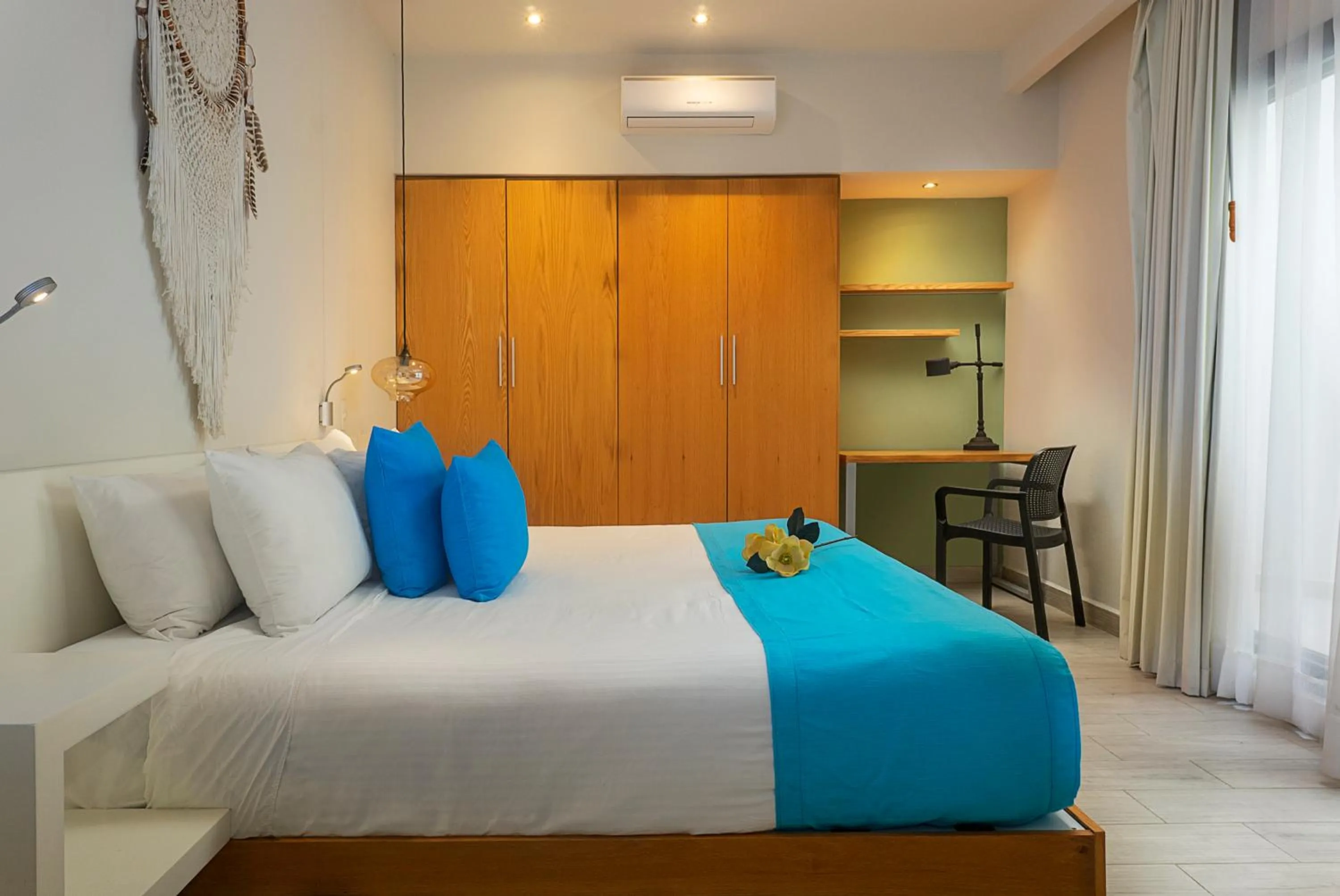 Bed in Opal Suites Apartments