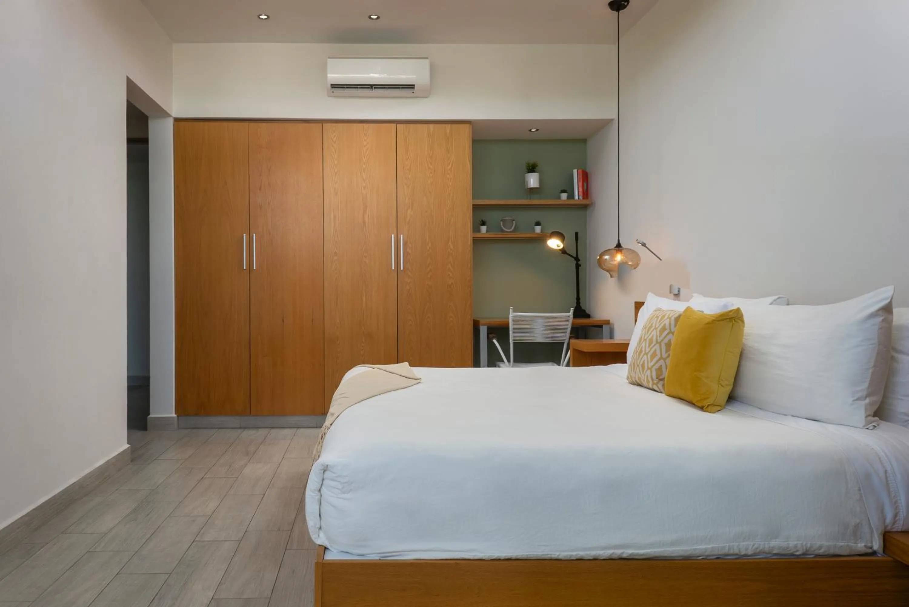 Bed in Opal Suites Apartments