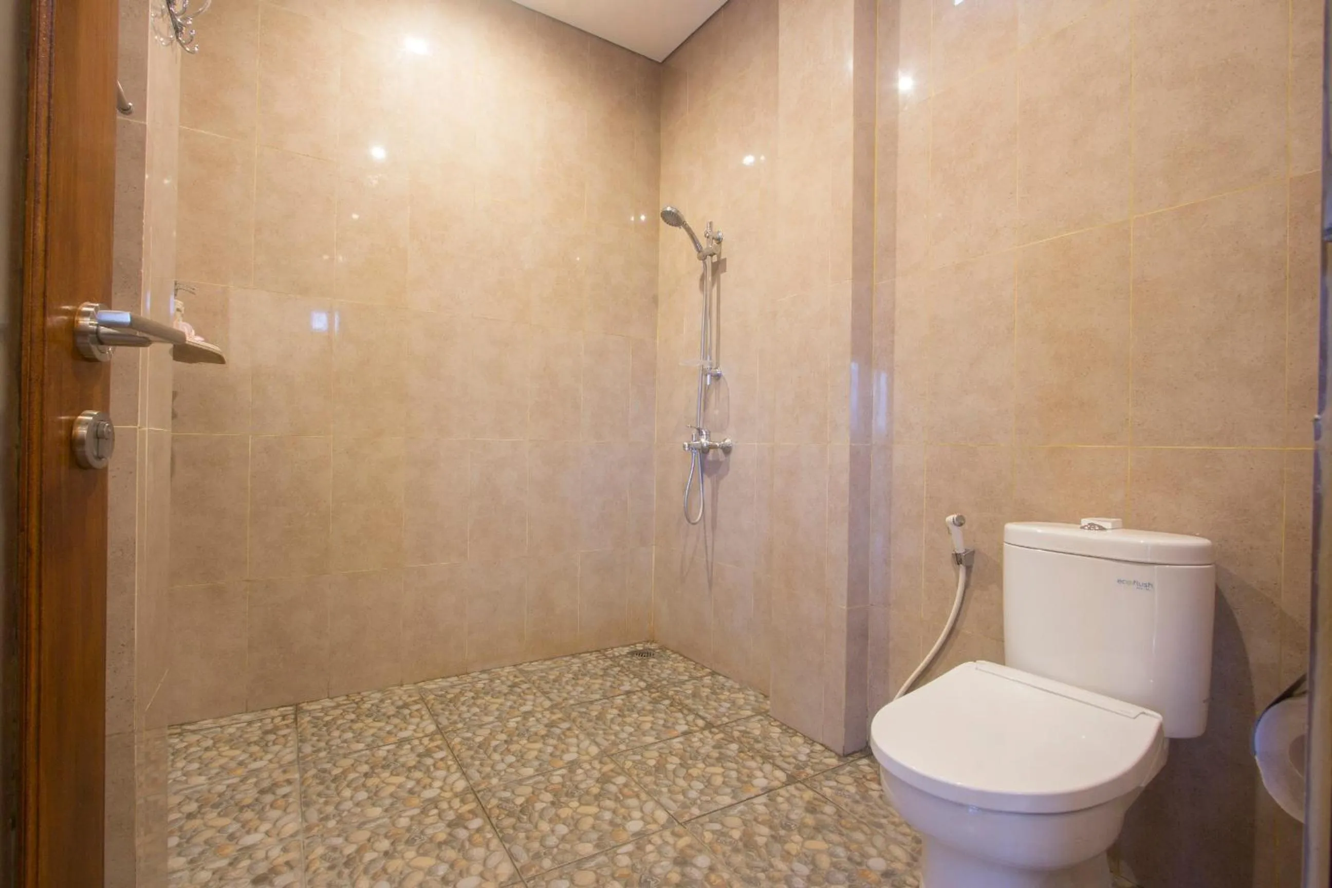 Bathroom in Adi Bisma Inn by Mahaputra-CHSE Certified