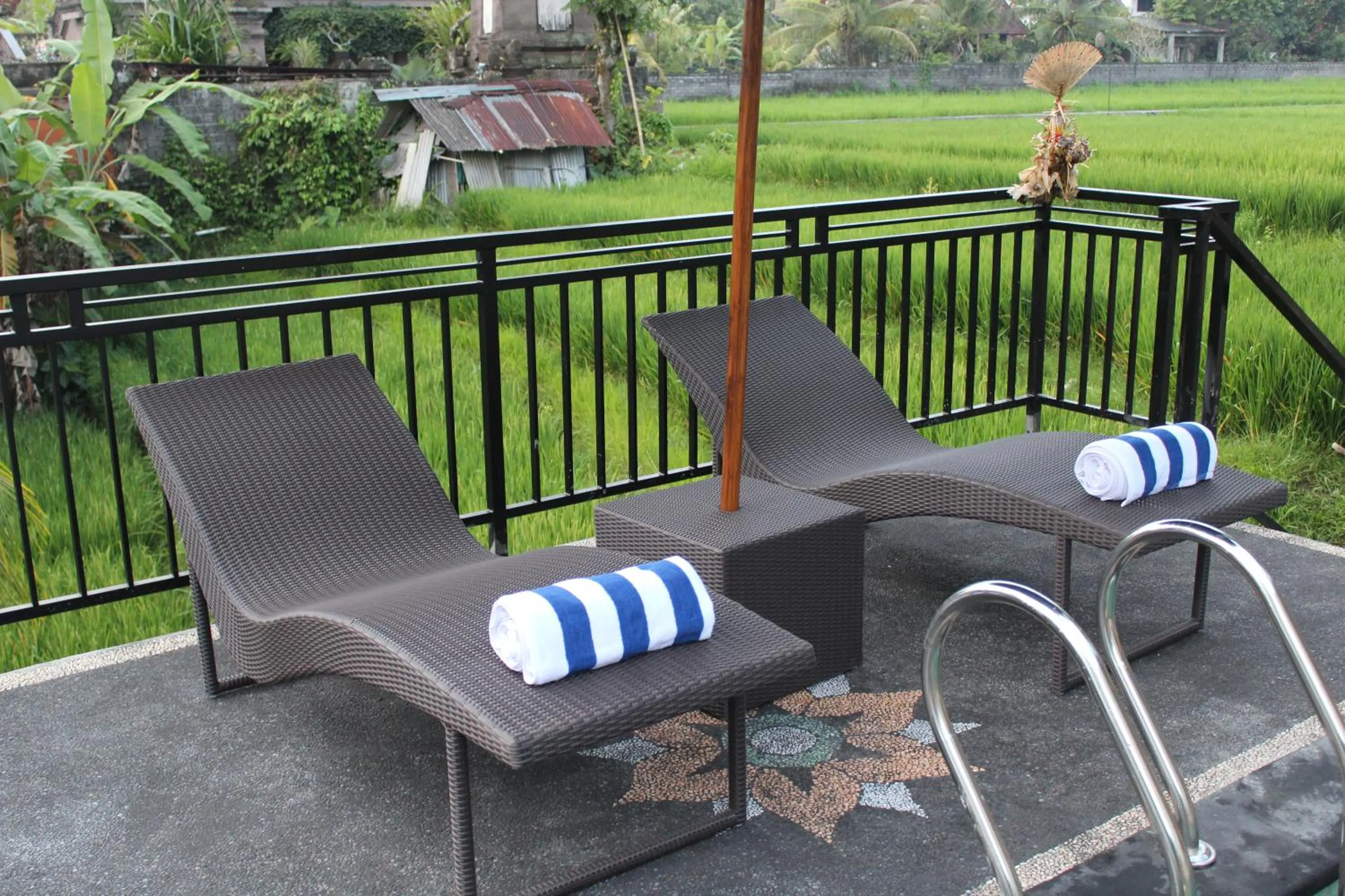 Communal lounge/ TV room in Adi Bisma Inn by Mahaputra-CHSE Certified