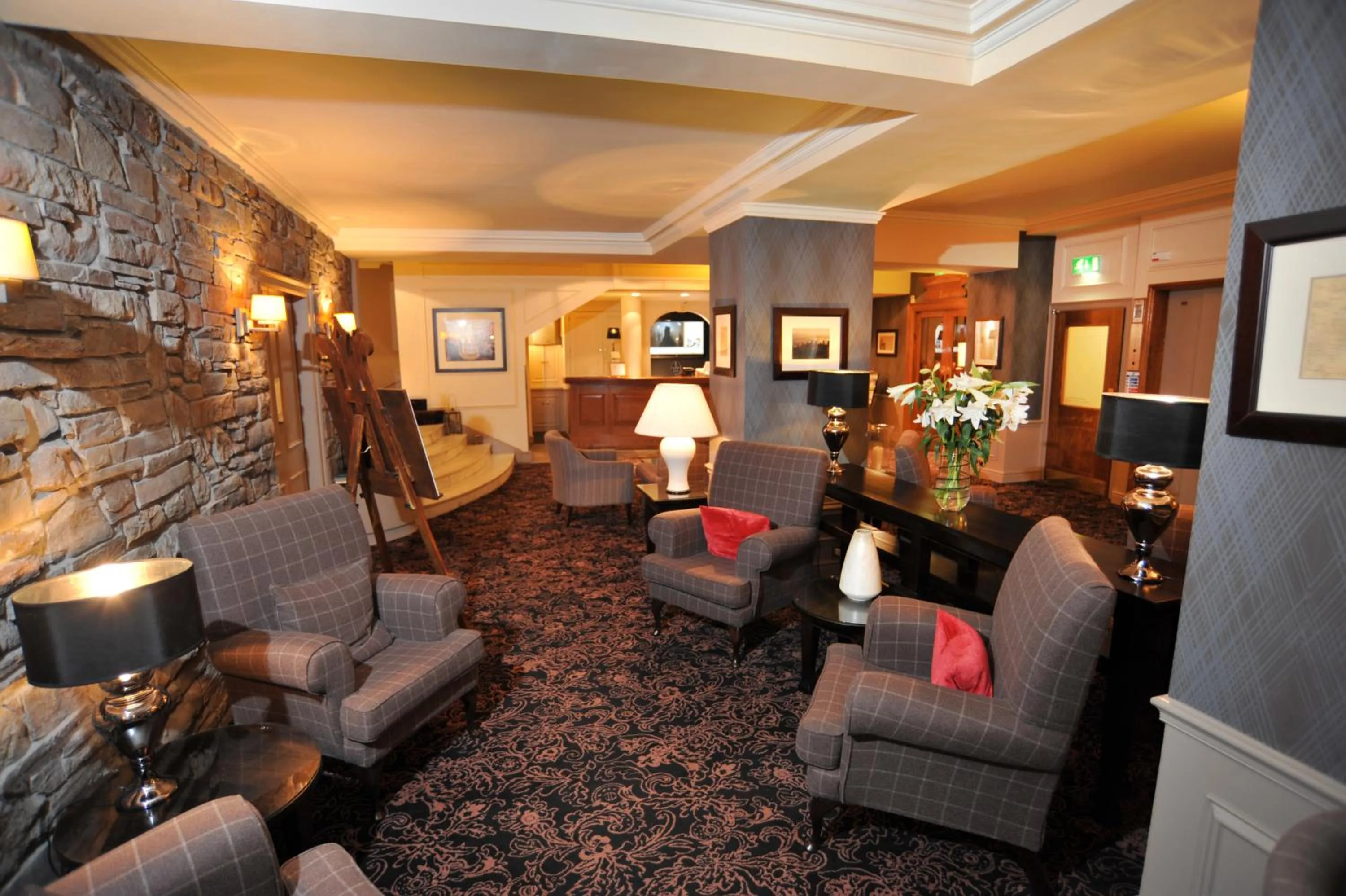 Communal lounge/ TV room in Golden Lion Hotel