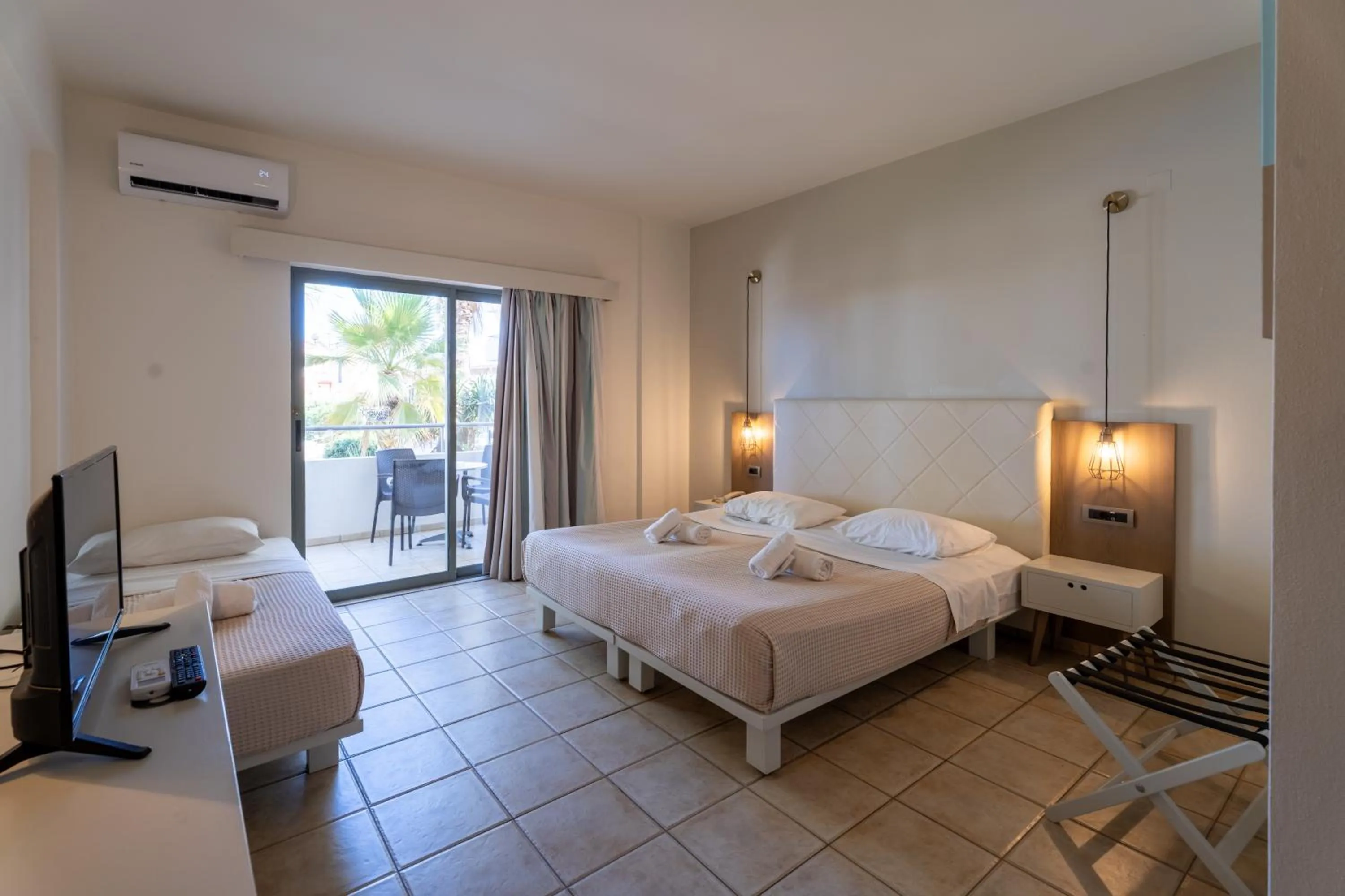 Bedroom, Bed in Gouves Bay by Omilos Hotels