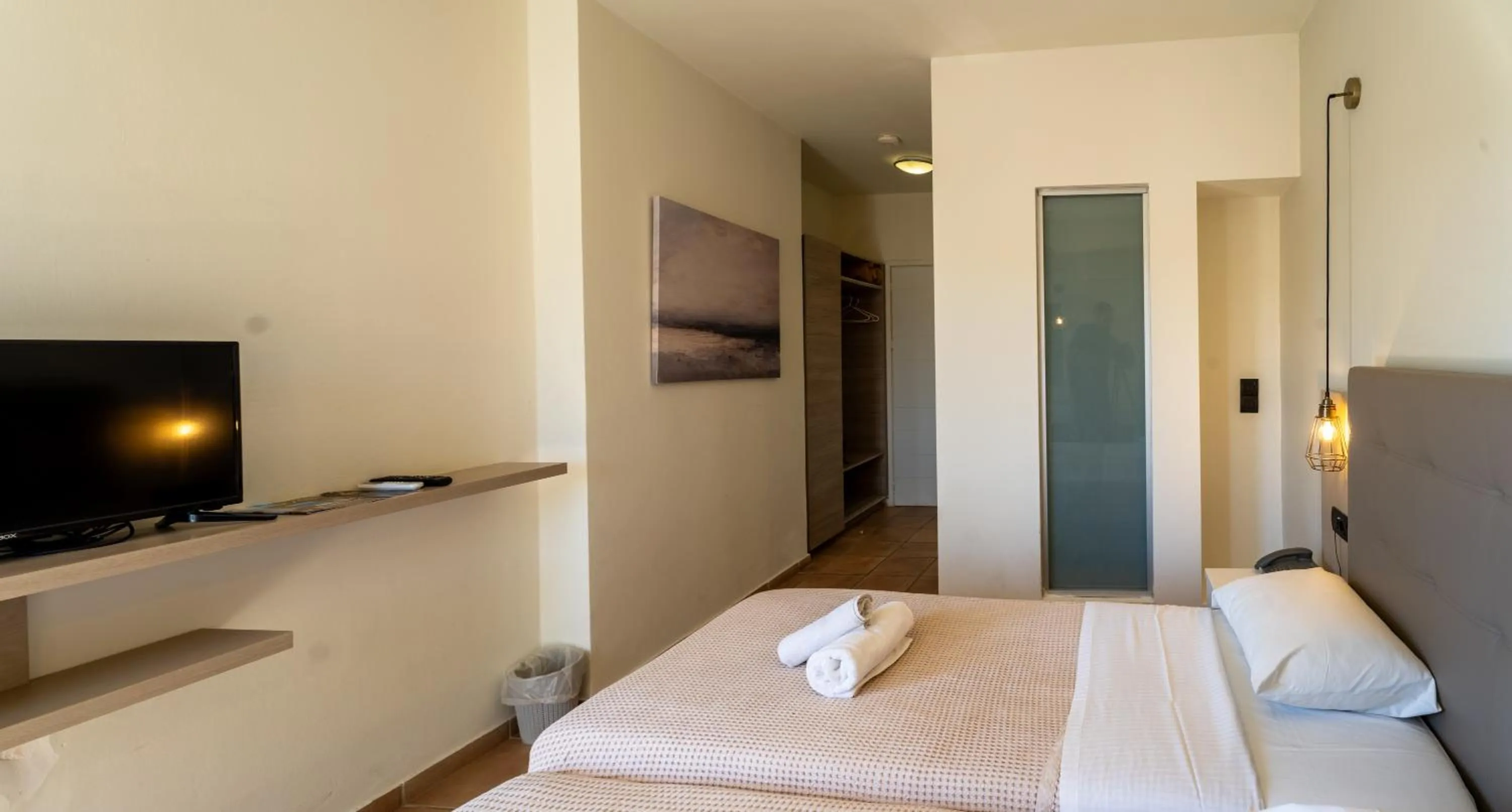 Bedroom, Bed in Gouves Bay by Omilos Hotels