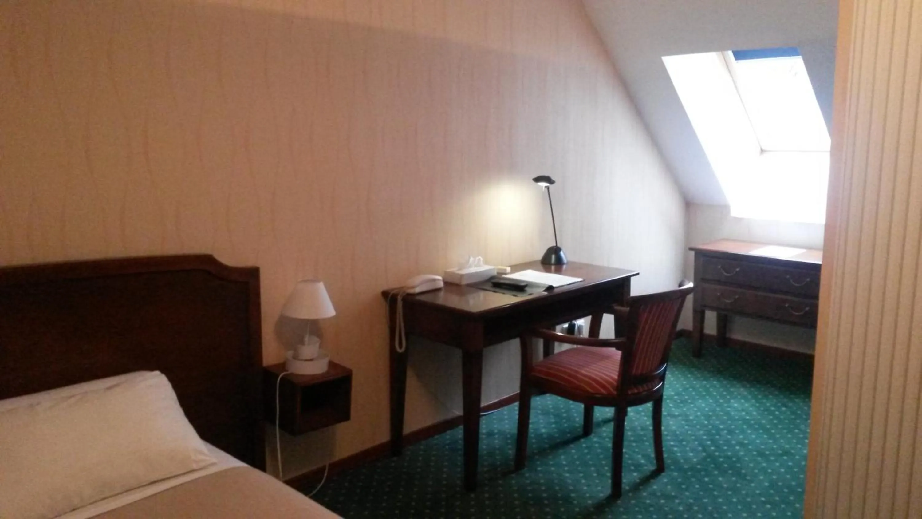 Bed in Hôtel de La Cloche