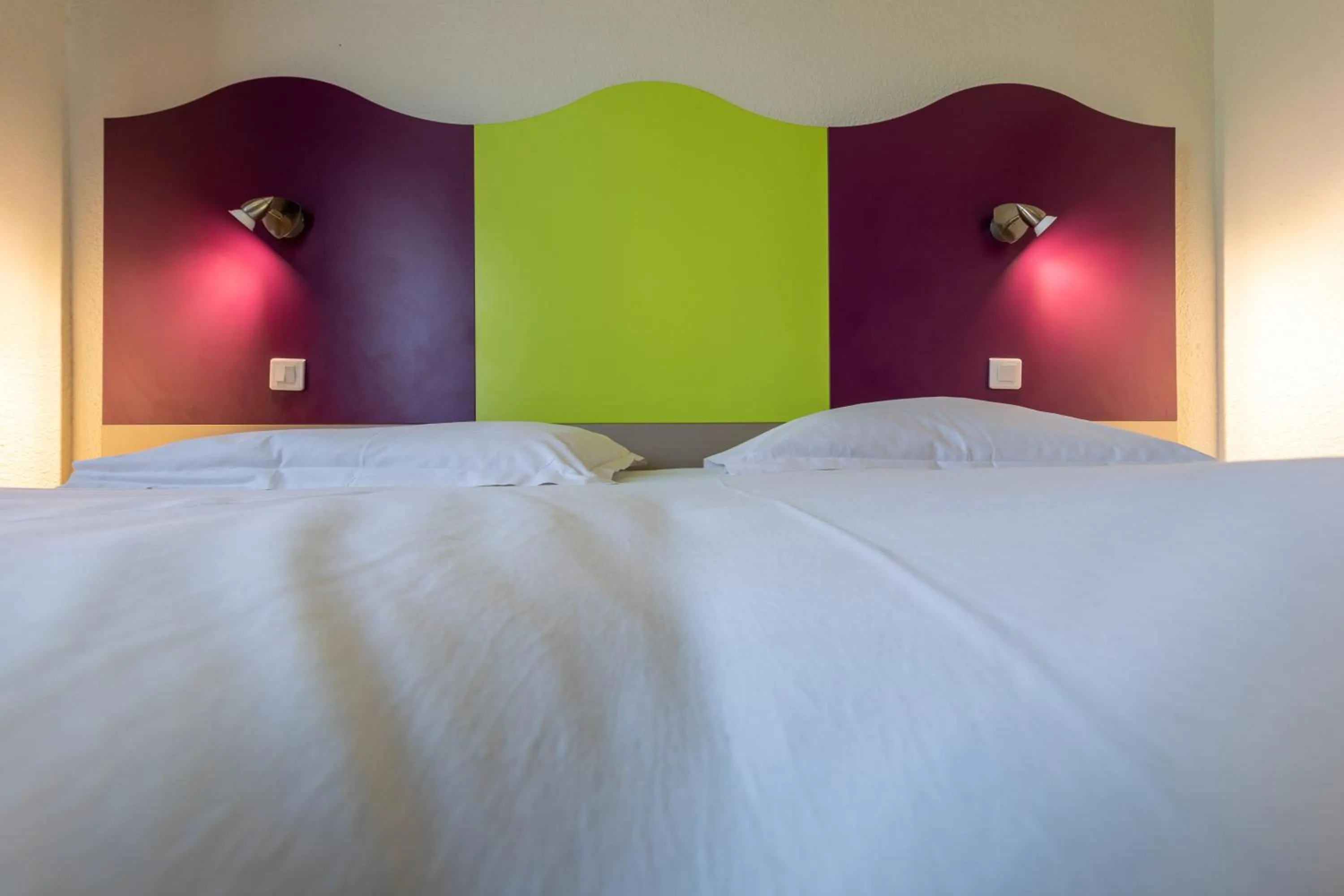 Bed in Logis Hotel Noemys pont de l'Etoile