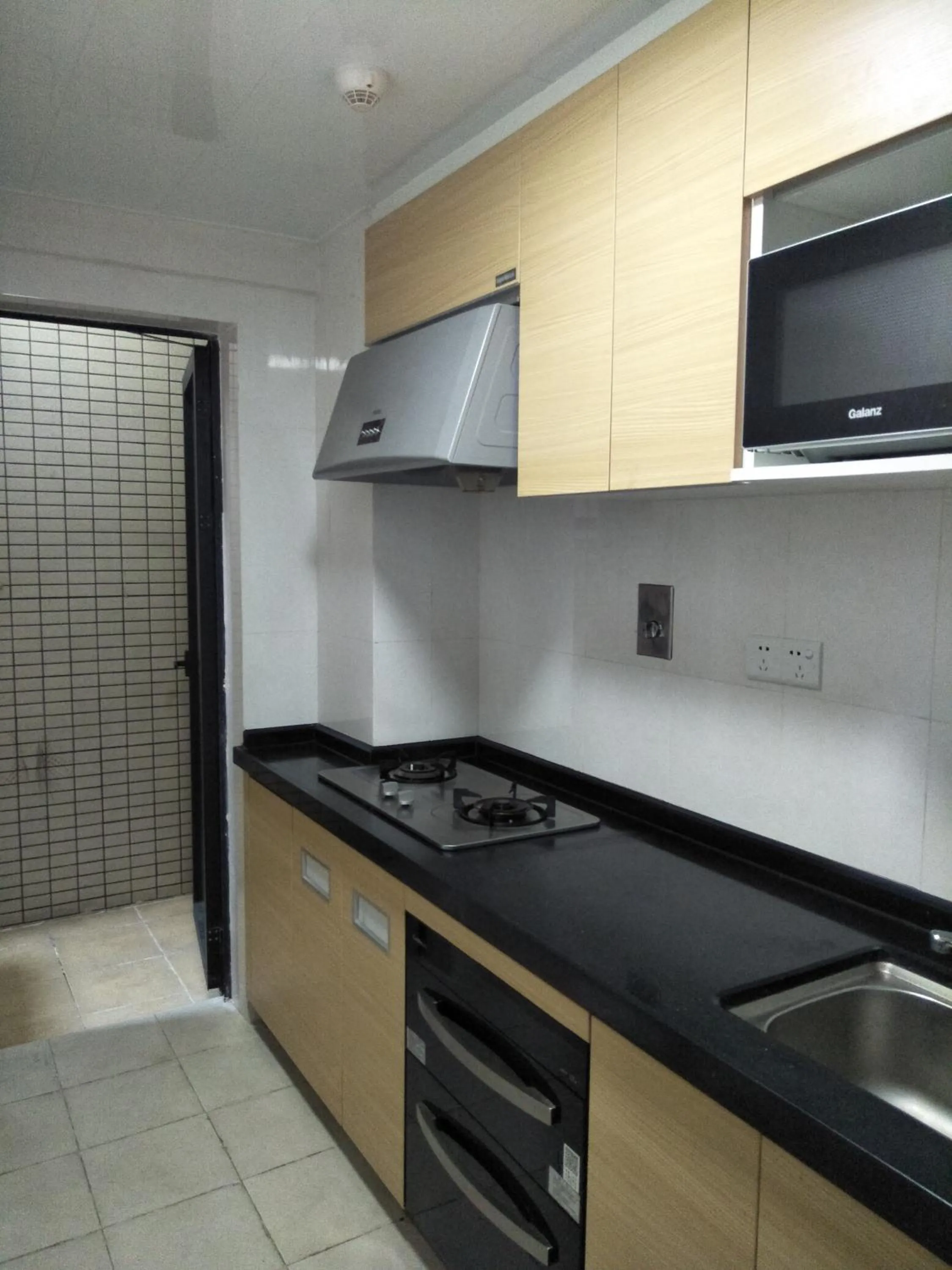 Kitchen or kitchenette in Pazhou Angda International Aparthotel Canton Fair Branch