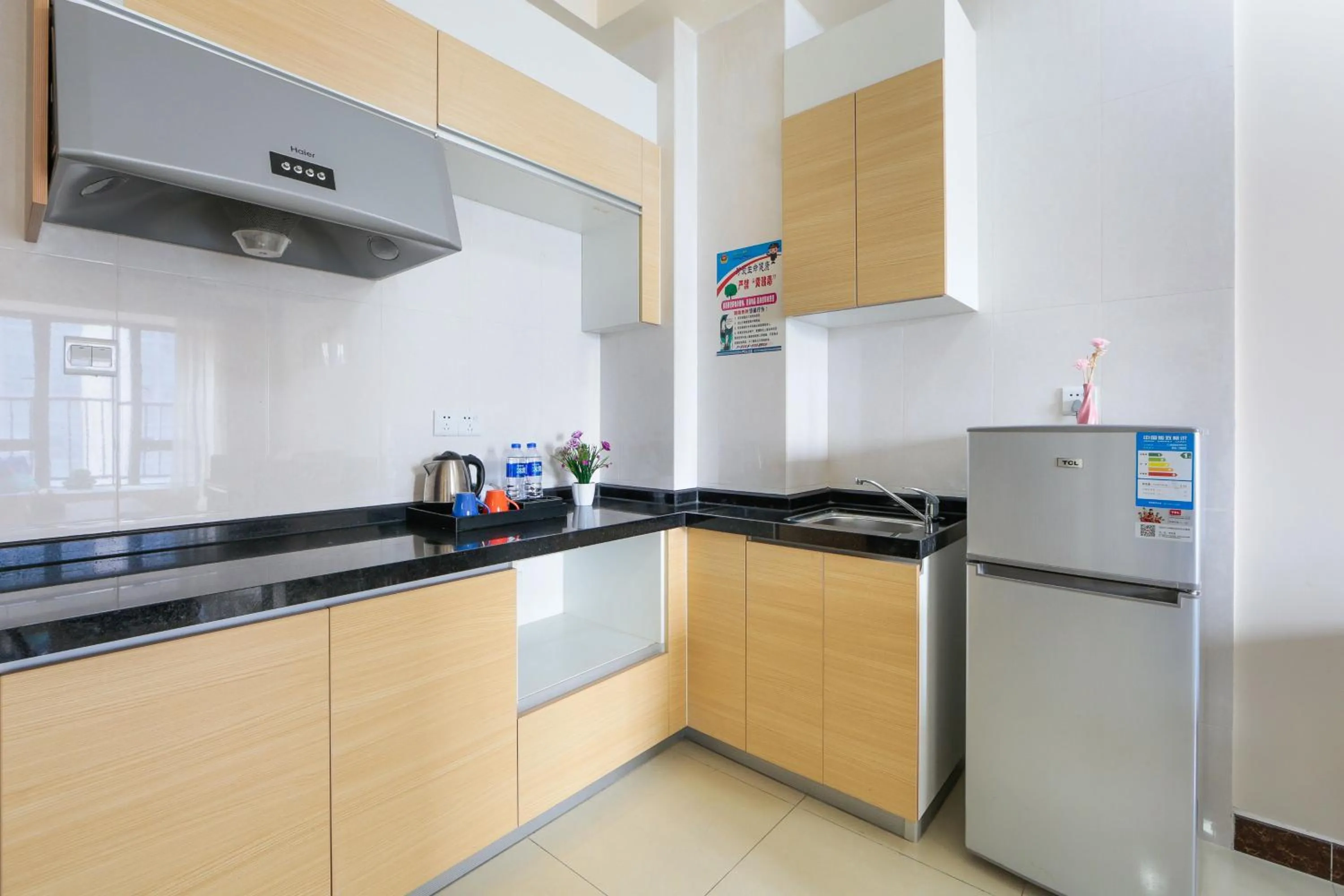 Kitchen or kitchenette in Pazhou Angda International Aparthotel Canton Fair Branch