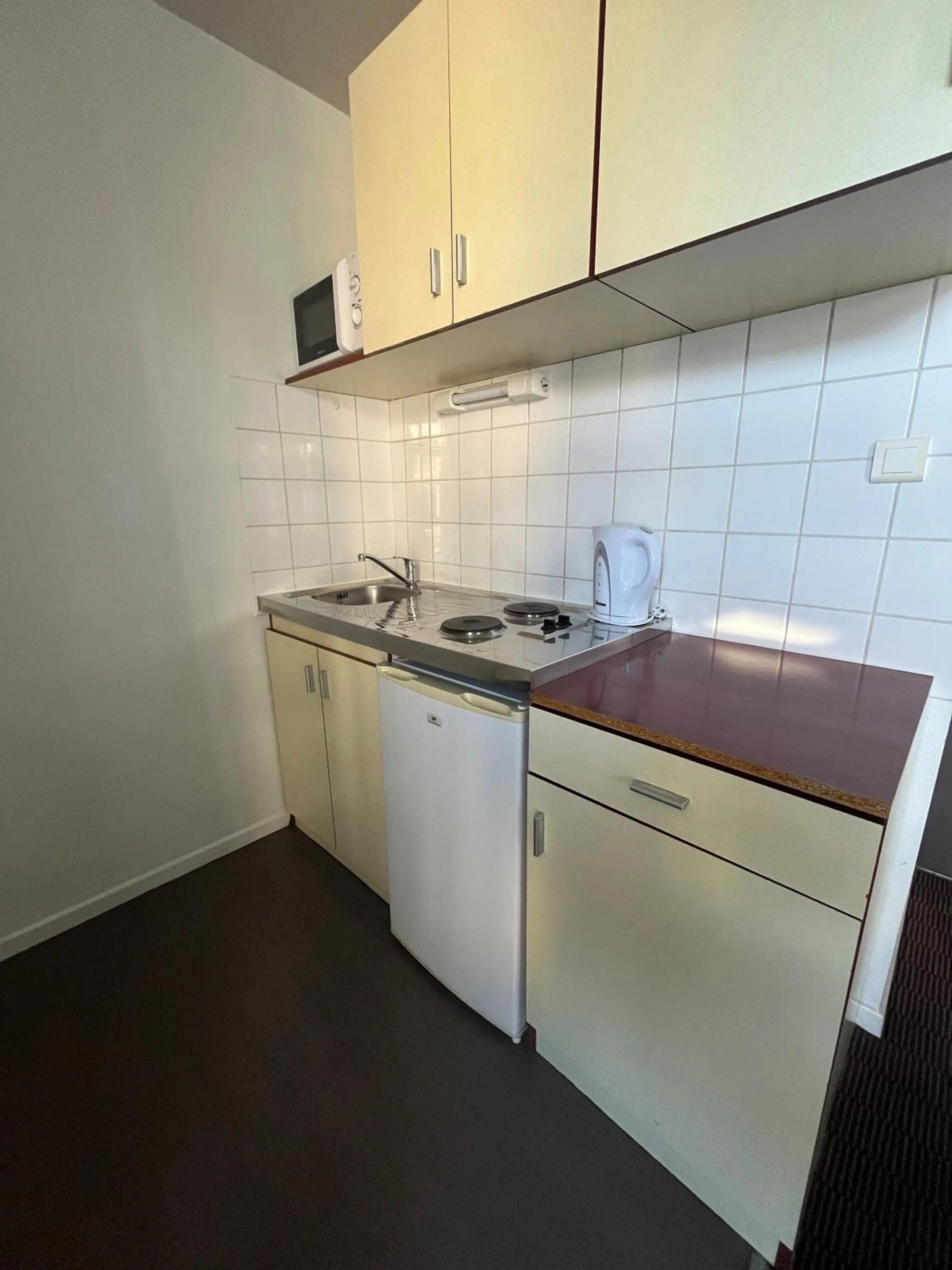 Kitchen or kitchenette in City Résidence Nancy