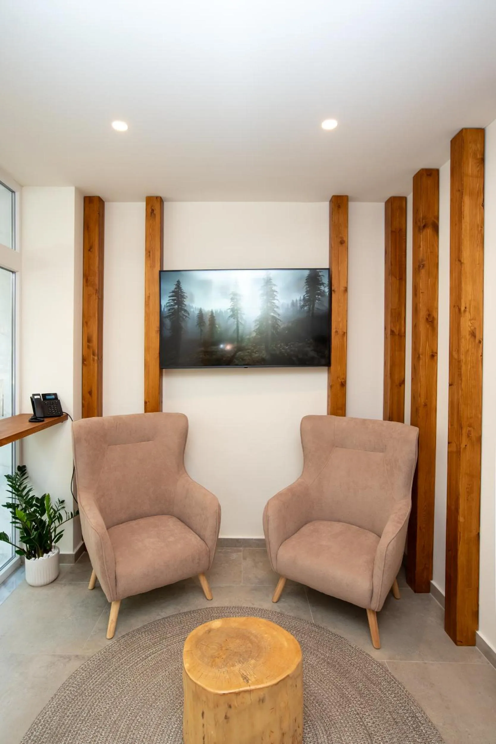 Communal lounge/ TV room in White Luxury