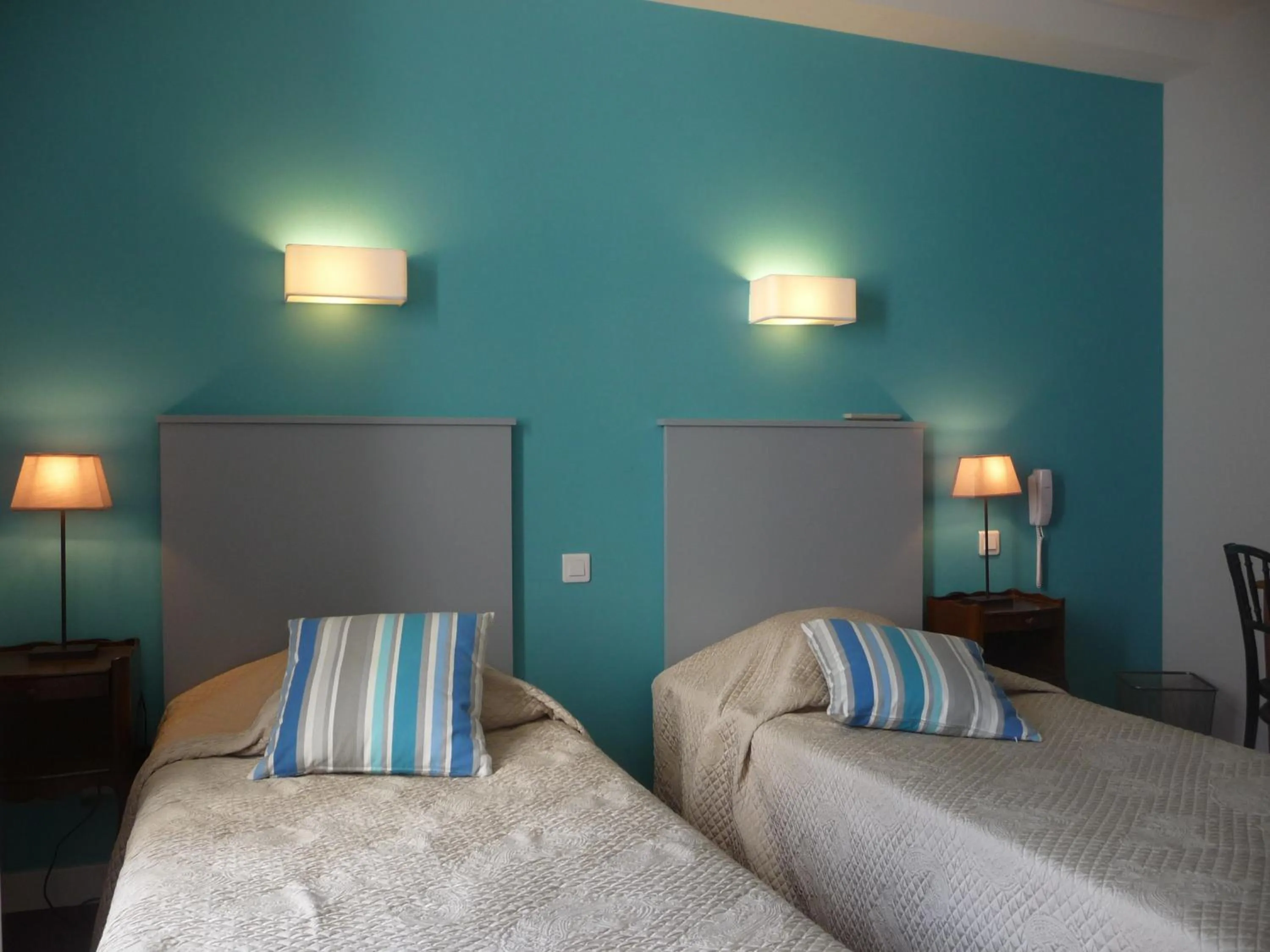 Bedroom in Hôtel Le Saphir