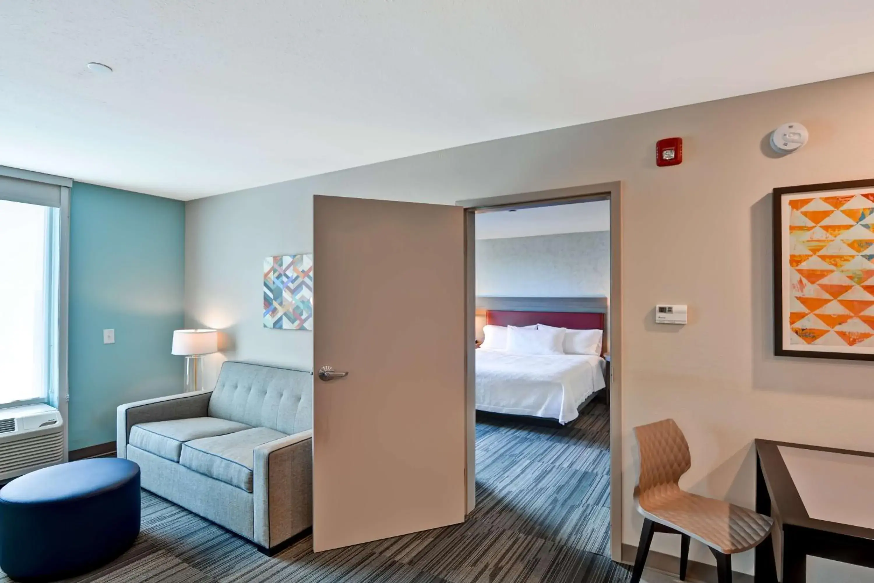 Living room, Bed in Home2 Suites By Hilton Tampa USF Near Busch Gardens Living room, Bed in Home2 Suites By Hilton Tampa USF Near Busch Gardens