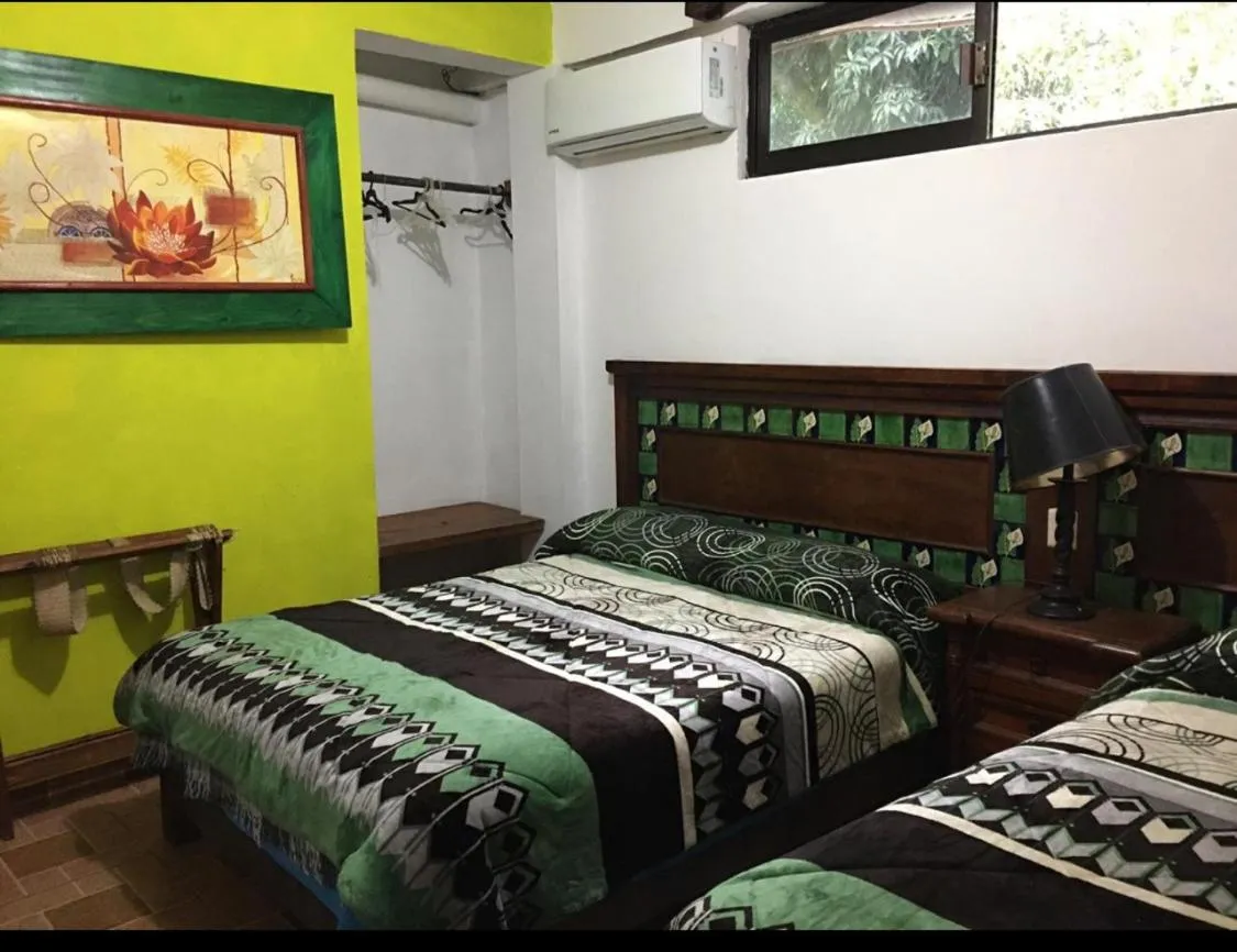 Bed in Hotel Posada San Agustin