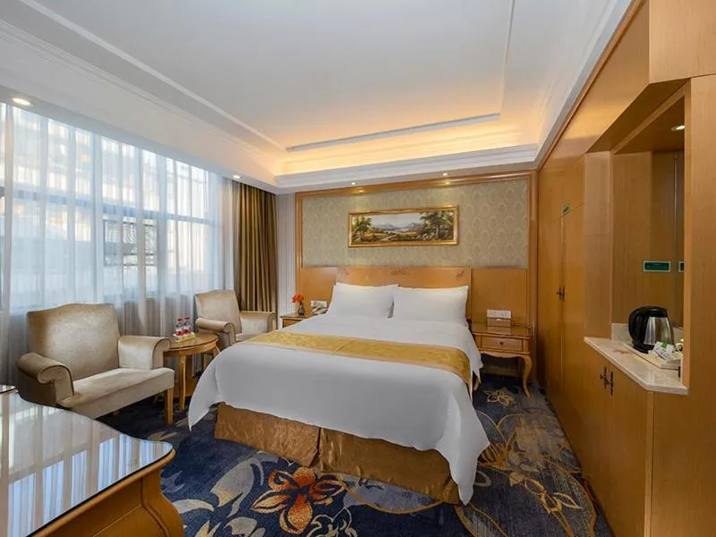 Bed in Vienna Hotel Meizhou Jiangnan