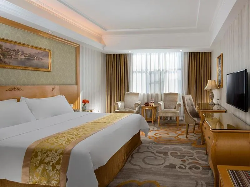 Bed in Vienna Hotel Meizhou Jiangnan