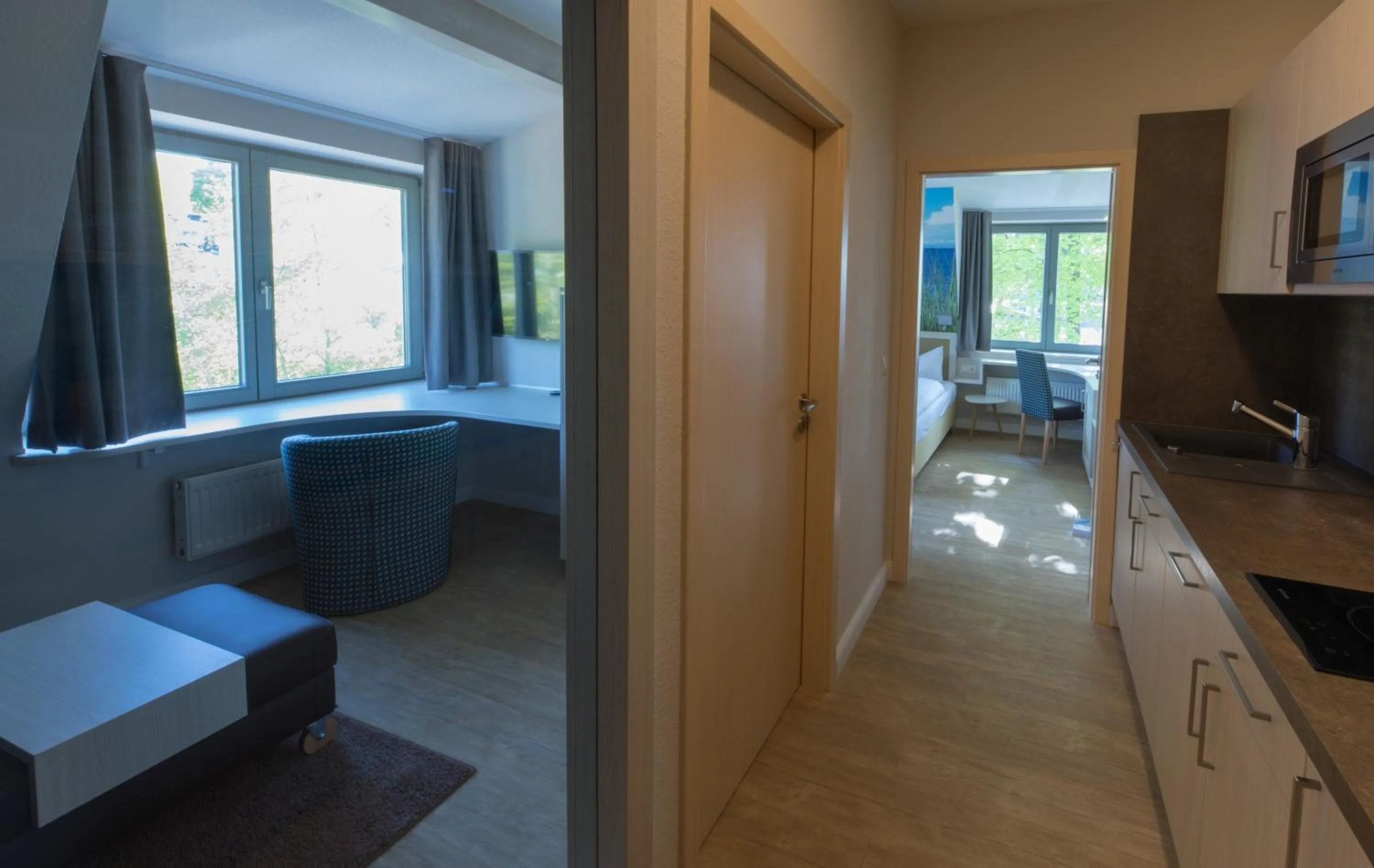 Kitchen or kitchenette, Bed in Hotel Haus am Meer