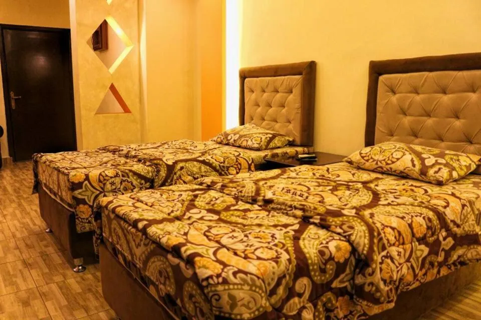 Bed in Al Riyati Hotel Apartments