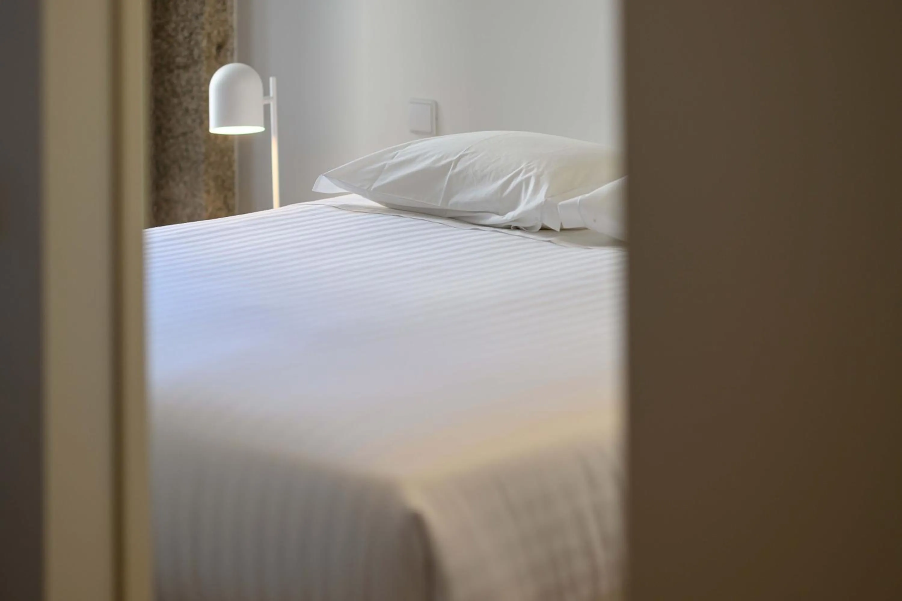 Bed in Pause Apartments