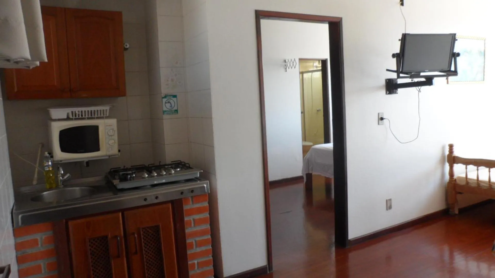 Communal kitchen in Apart Hotel La Cabana