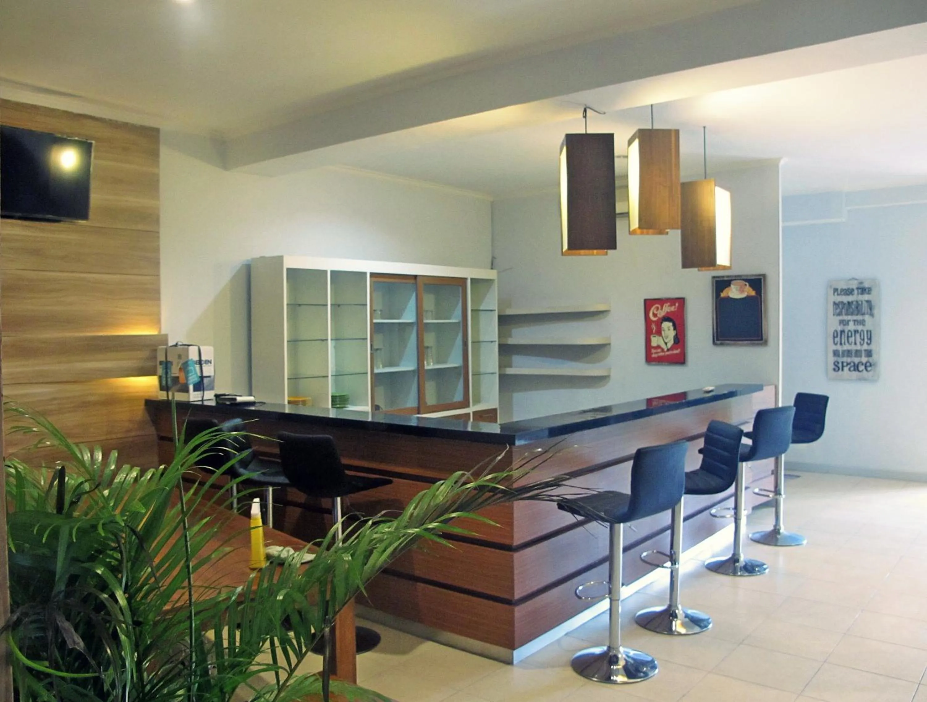 Lounge or bar in The Alley City Hotel