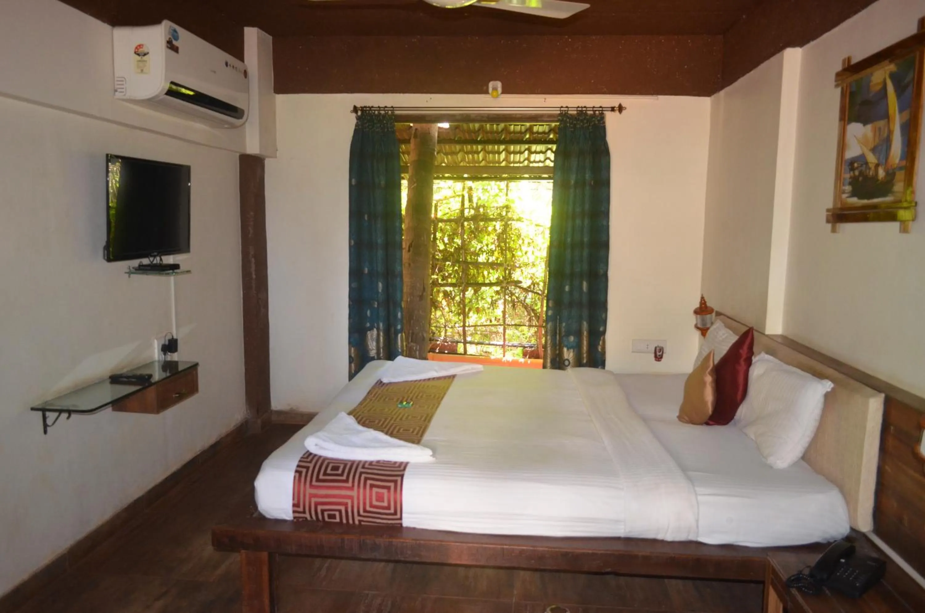 Bed in Kaular Atithis Grand Kokan Resort