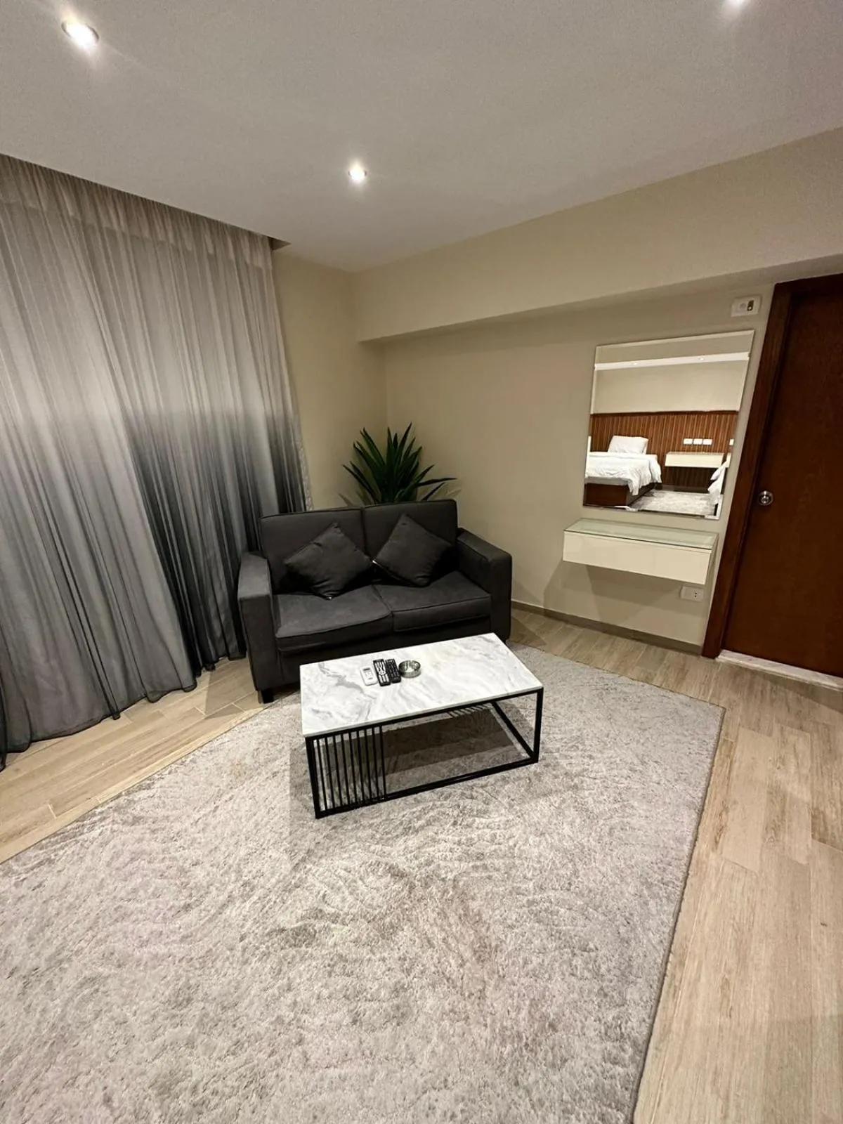 Seating area, Bed in Nakhil Inn Residence