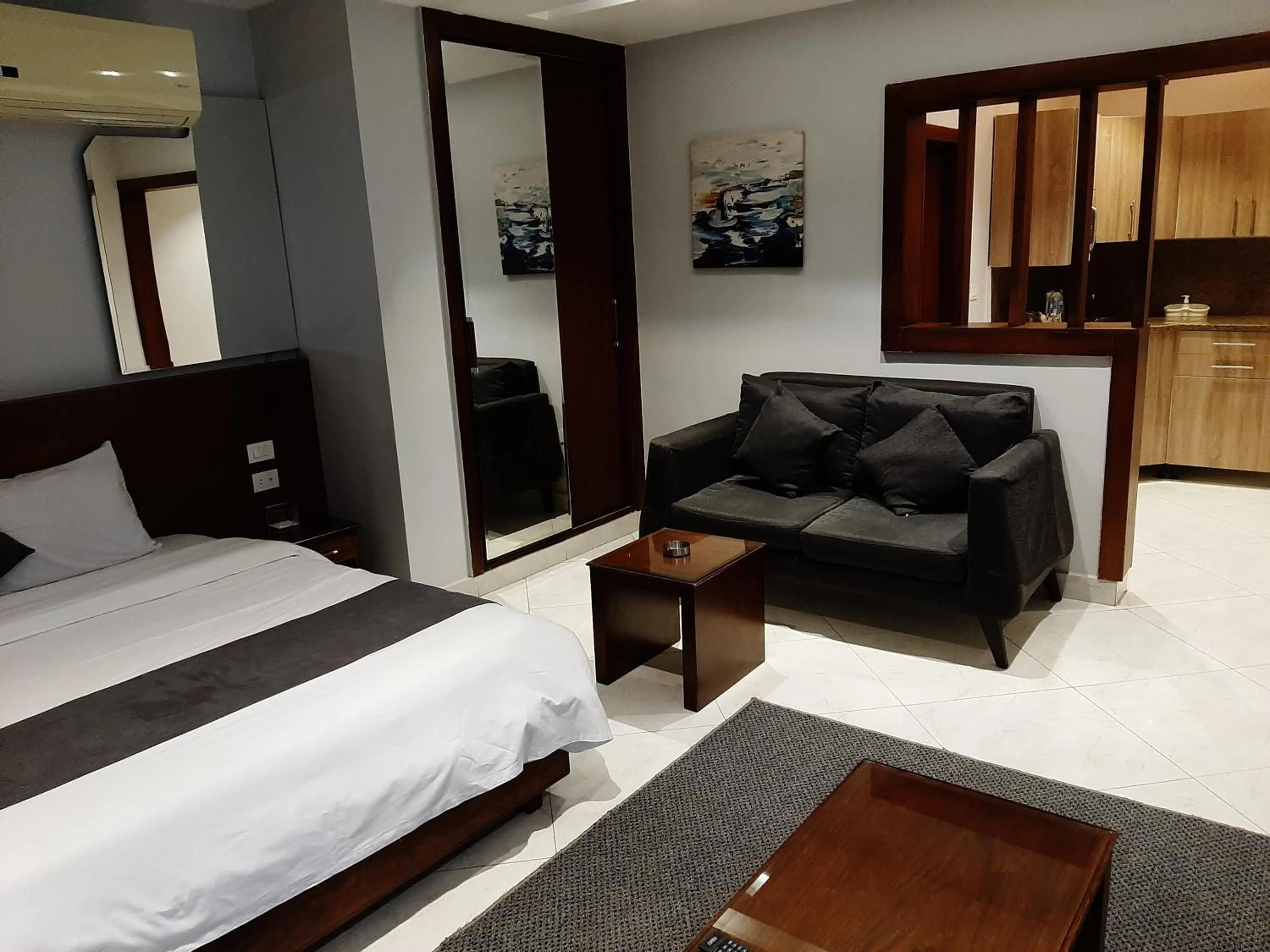 Seating area, Bed in Nakhil Inn Residence