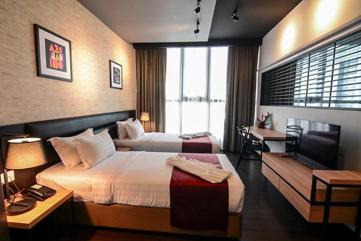 Bed in The Granite Luxury Hotel Penang