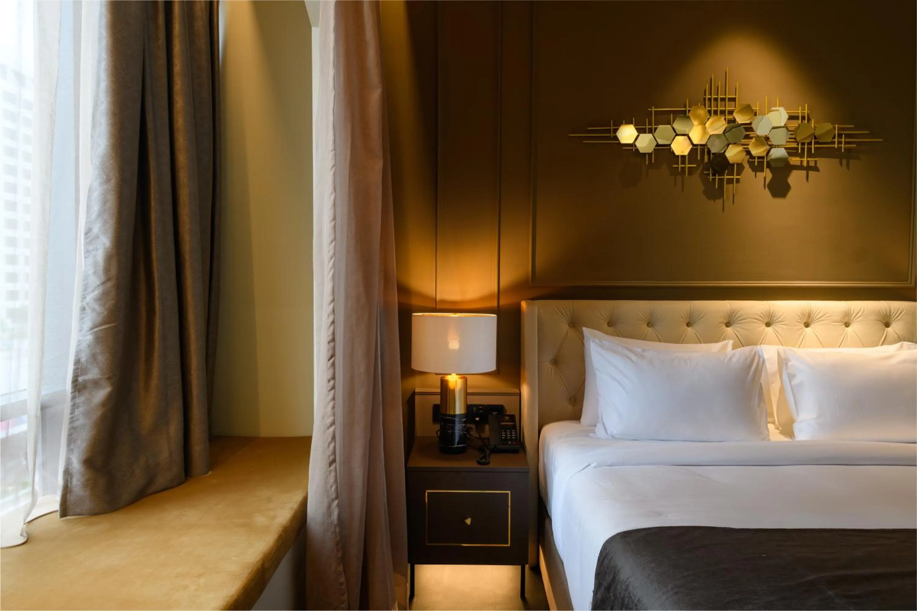 Bed in The Granite Luxury Hotel Penang