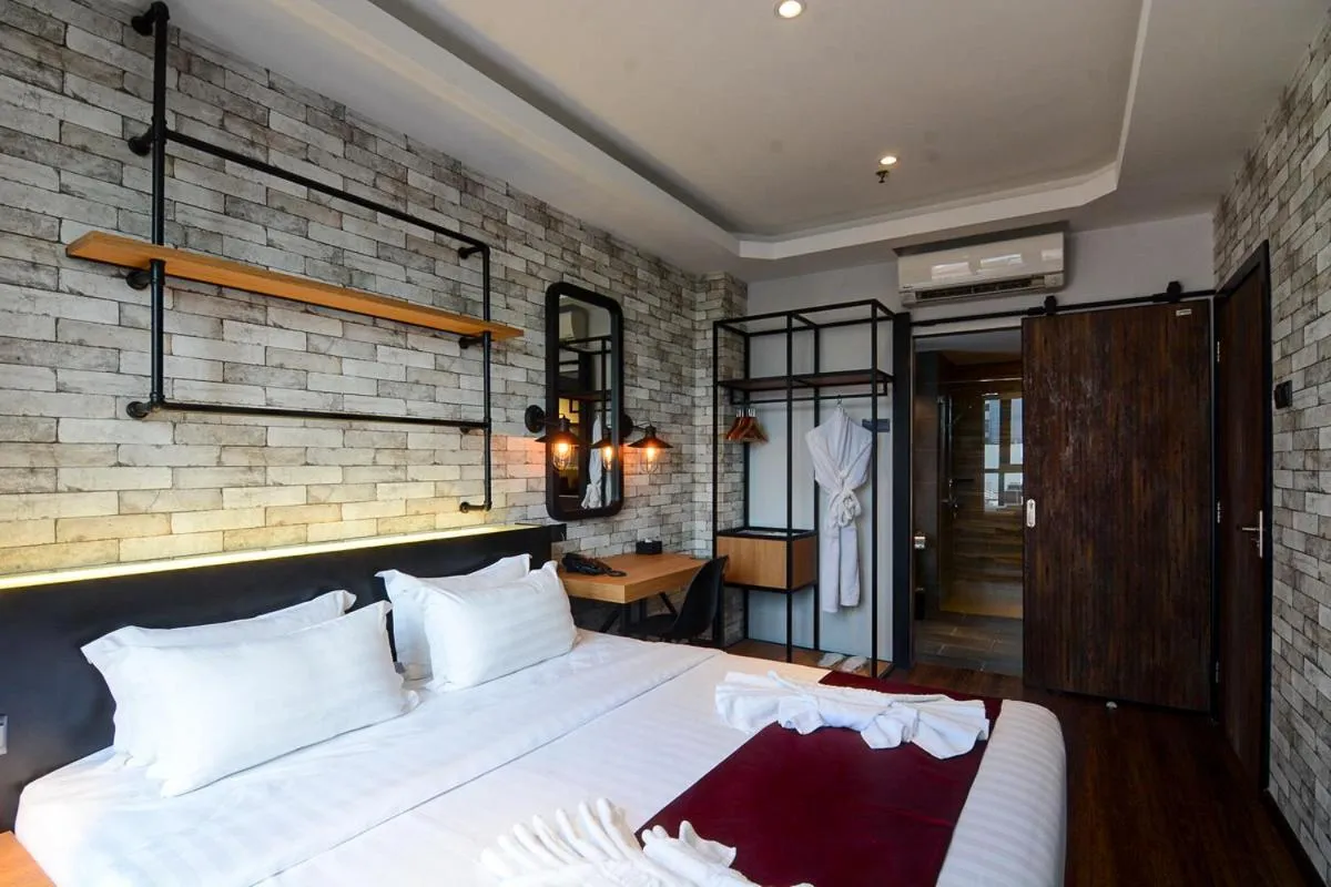 Bed in The Granite Luxury Hotel Penang