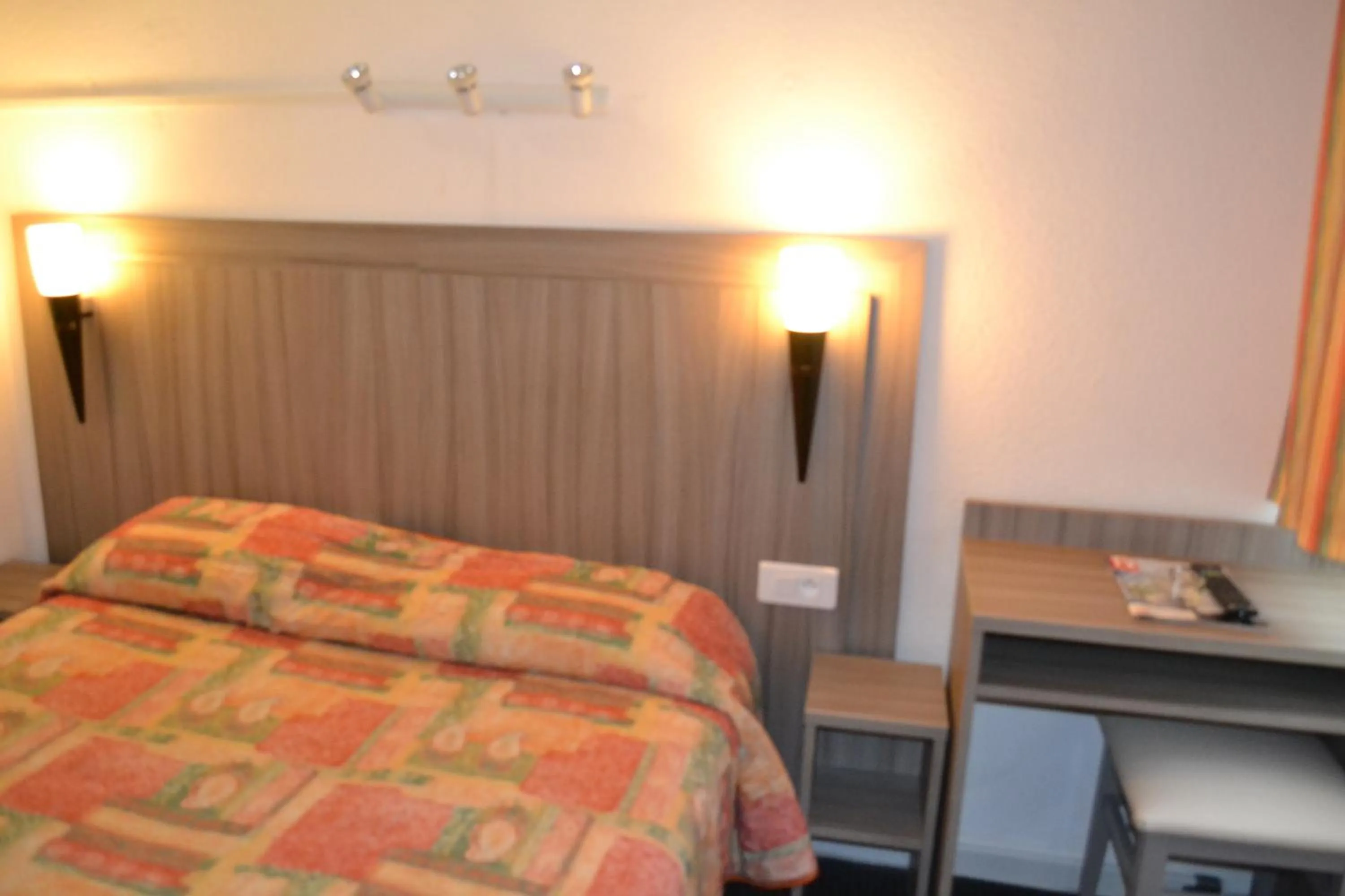 Bed in Initial by Balladins Béthune