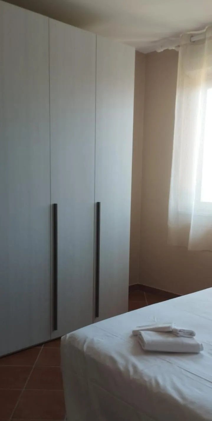 Photo of the whole room, Bed in Le Residenze di Santa Costanza - Il Lentisco