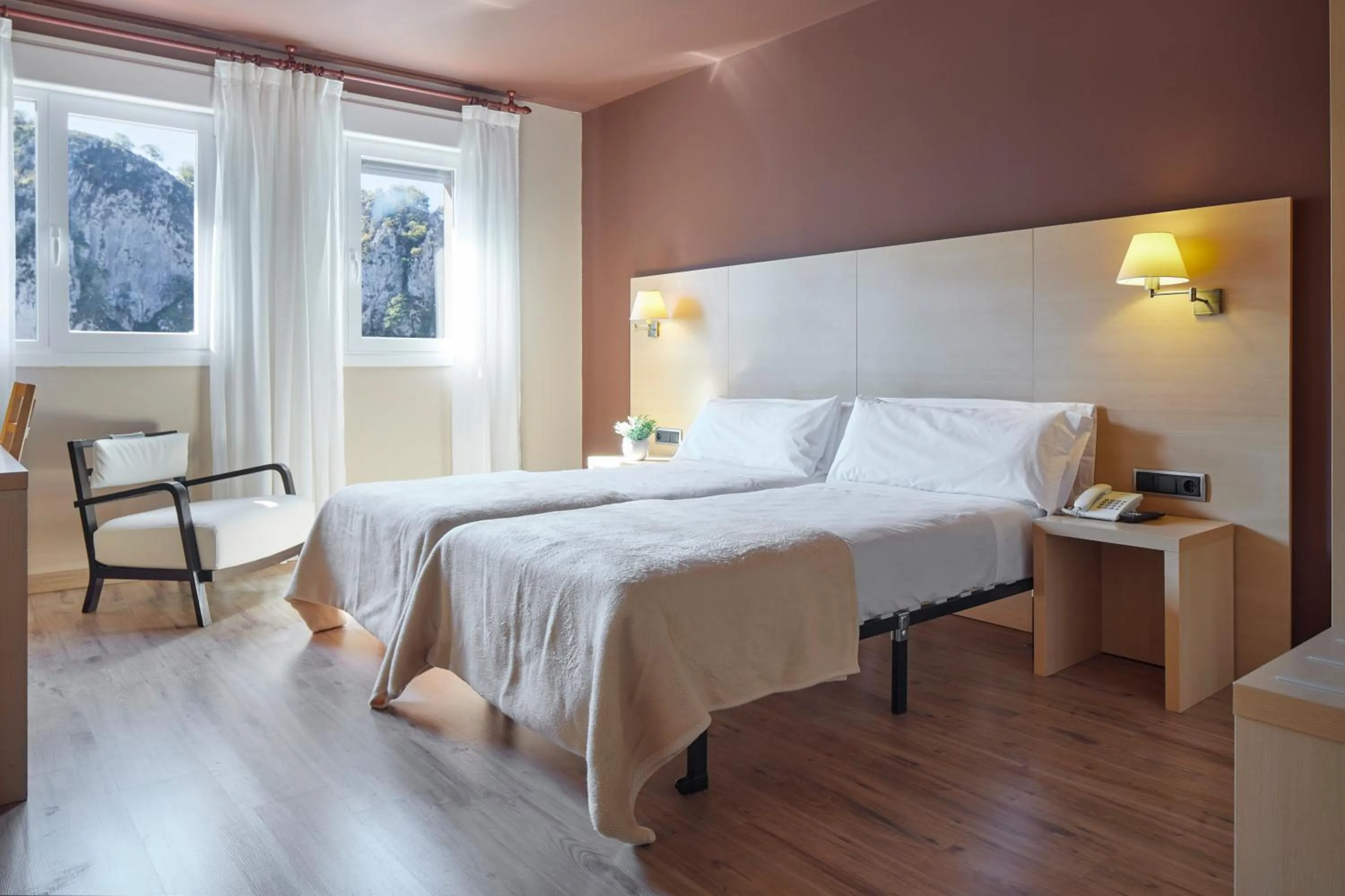 Text overlay, Bed in Iraipe Santuario de Arantzazu Hotel