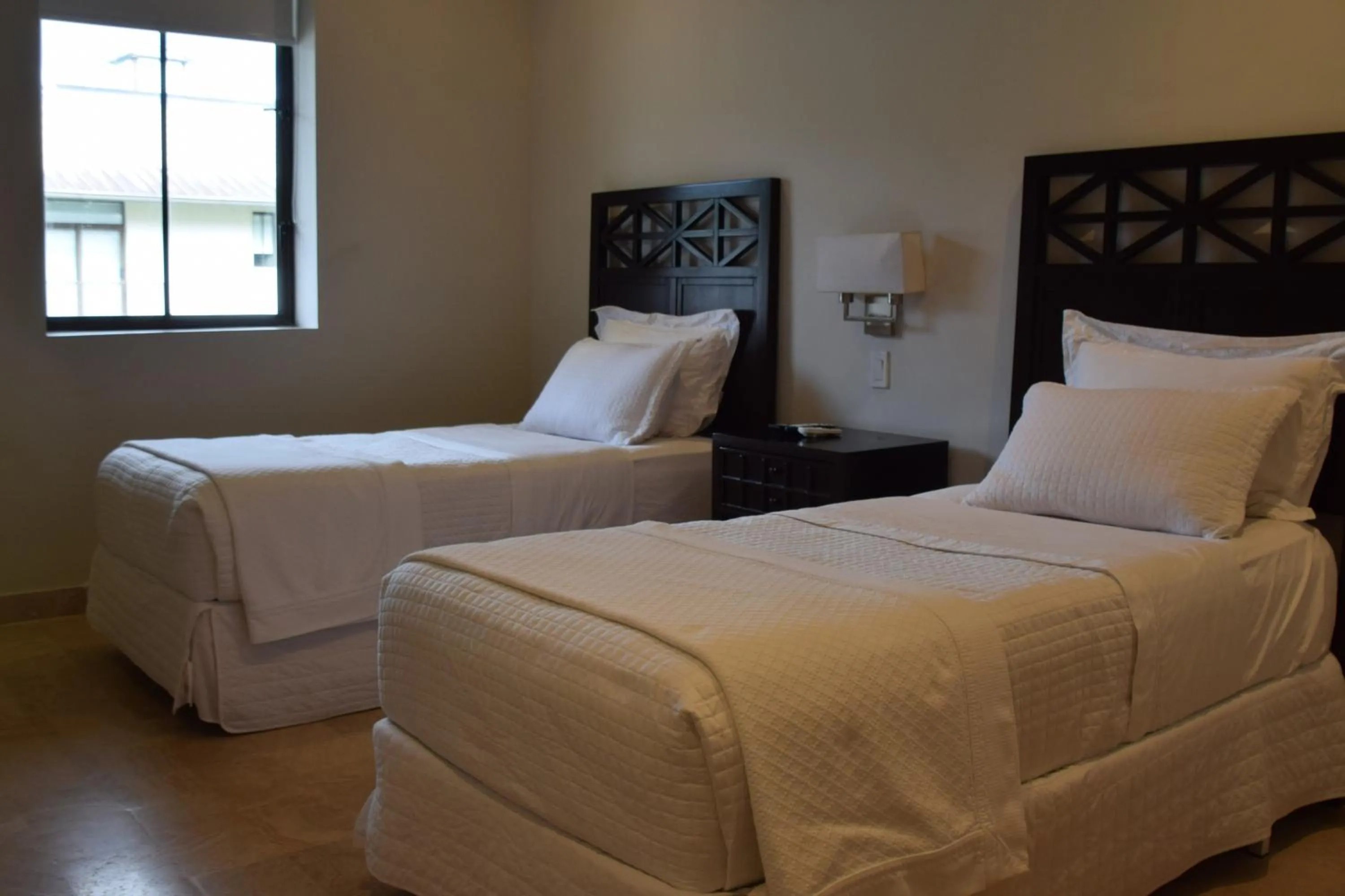 Bed in Paseo Suites El Valle, Luxury Apartments
