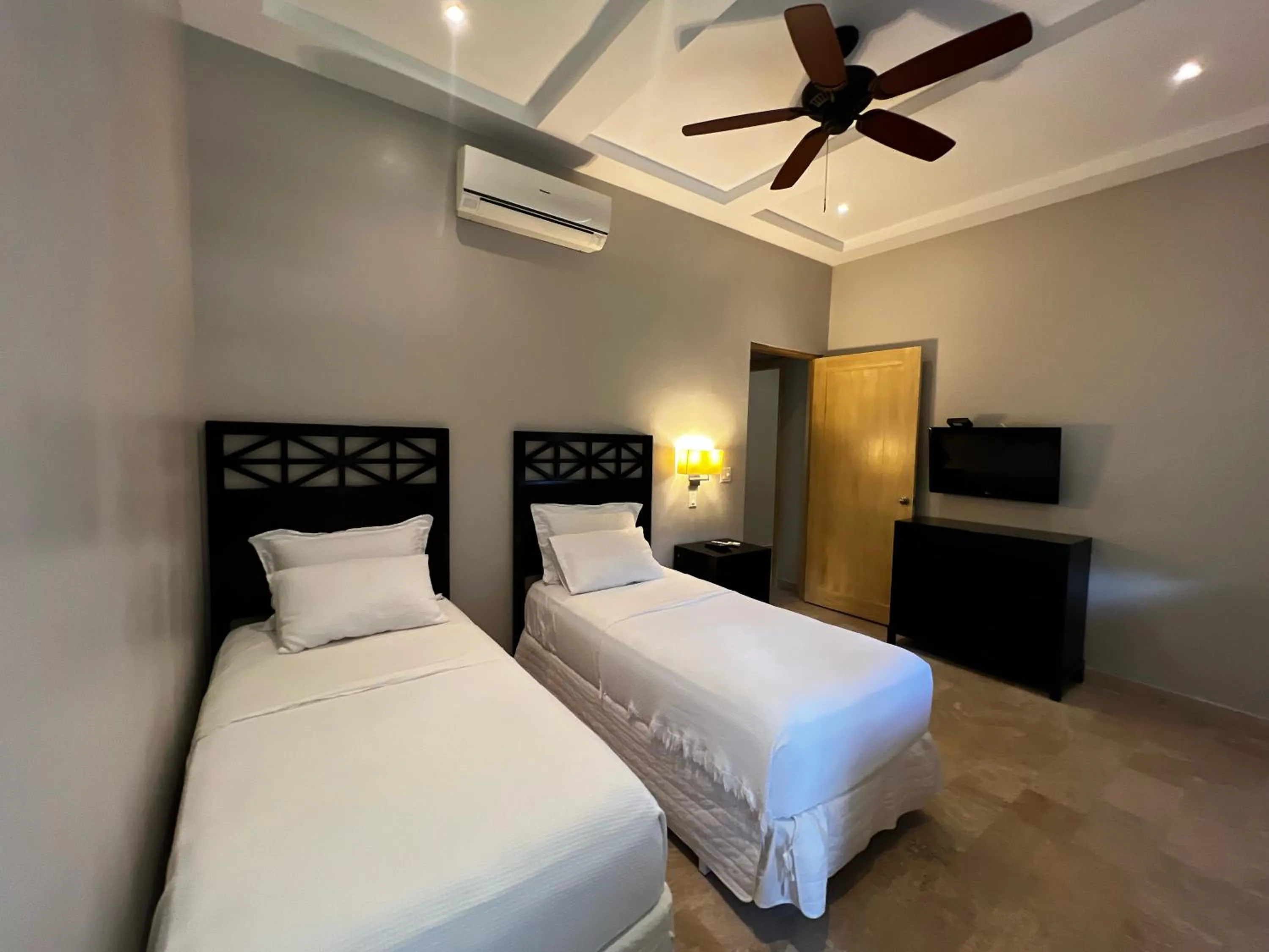 Bed in Paseo Suites El Valle, Luxury Apartments