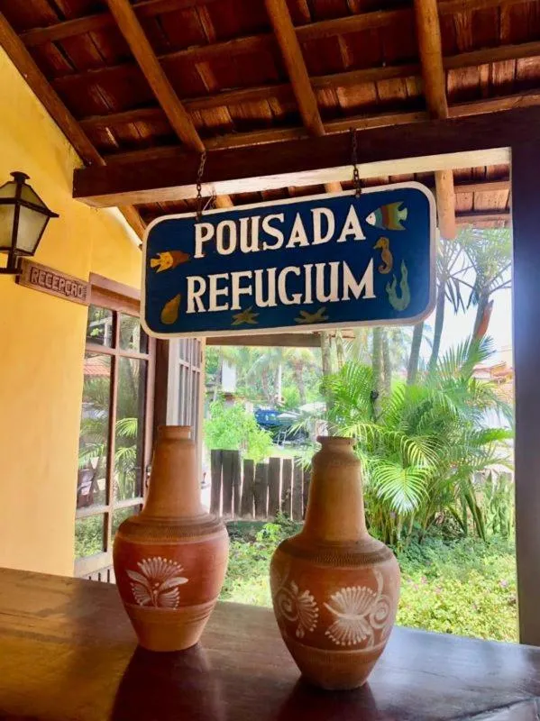 Logo/Certificate/Sign in Pousada Refugium